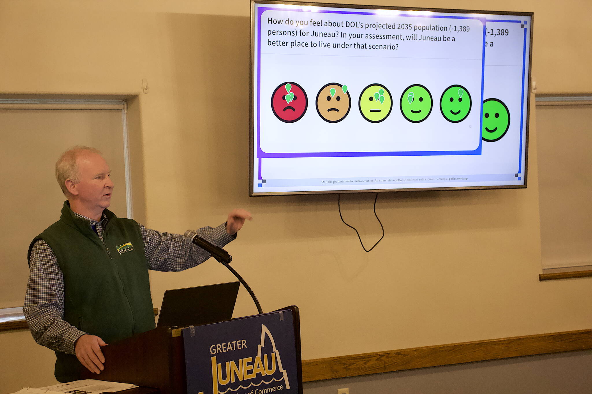 Brian Holst, executive director of the Juneau Economic Development Council, presents findings from JEDC’s annual economic indicators report during a Greater Juneau Chamber of Commerce luncheon Thursday at the Juneau Moose Family Center. (Mark Sabbatini / Juneau Empire)