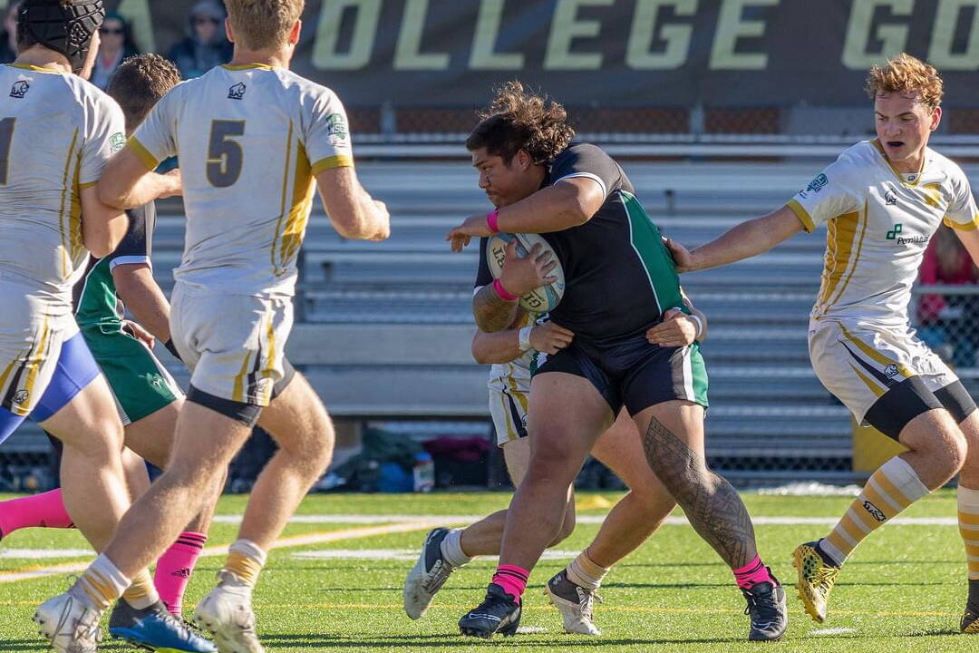 Lance Fenumiai, a Juneau resident seen here carrying the ball in a rugby match for St. Vincent College in Pennsylvania, has signed a Major League Rugby contract with the Dallas Jackals. (Photo courtesy of Lux214 Media Group)
