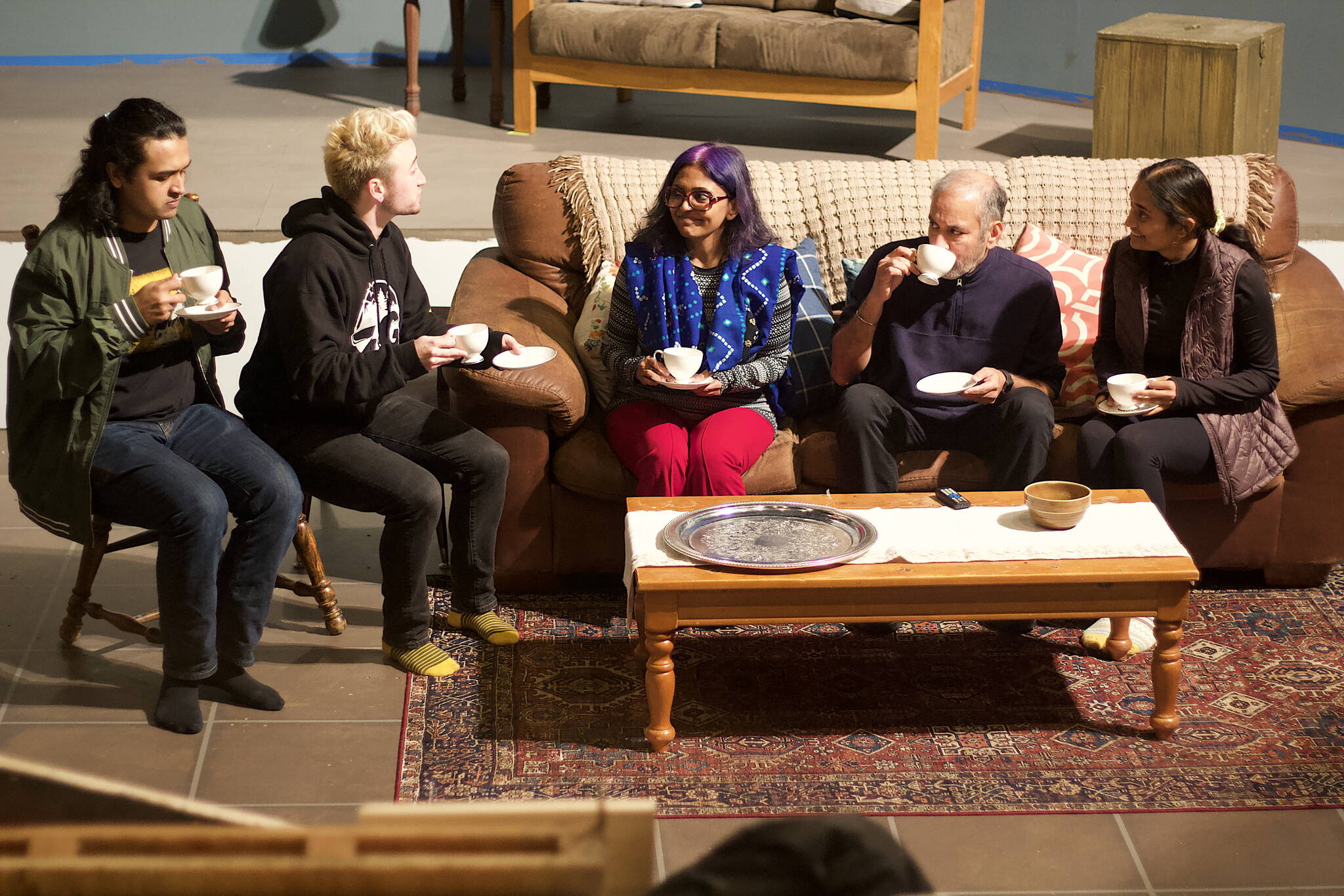 A meet-the-family scene is rehearsed Tuesday night by, from left to right, Tristan Cameron, Jack Scholz, Sukanya Sarkar, Dilip Ratnam and Aditi Sanghvi for Perseverance Theatre’s upcoming production of “A Nice Indian Boy.” (Mark Sabbatini / Juneau Empire)