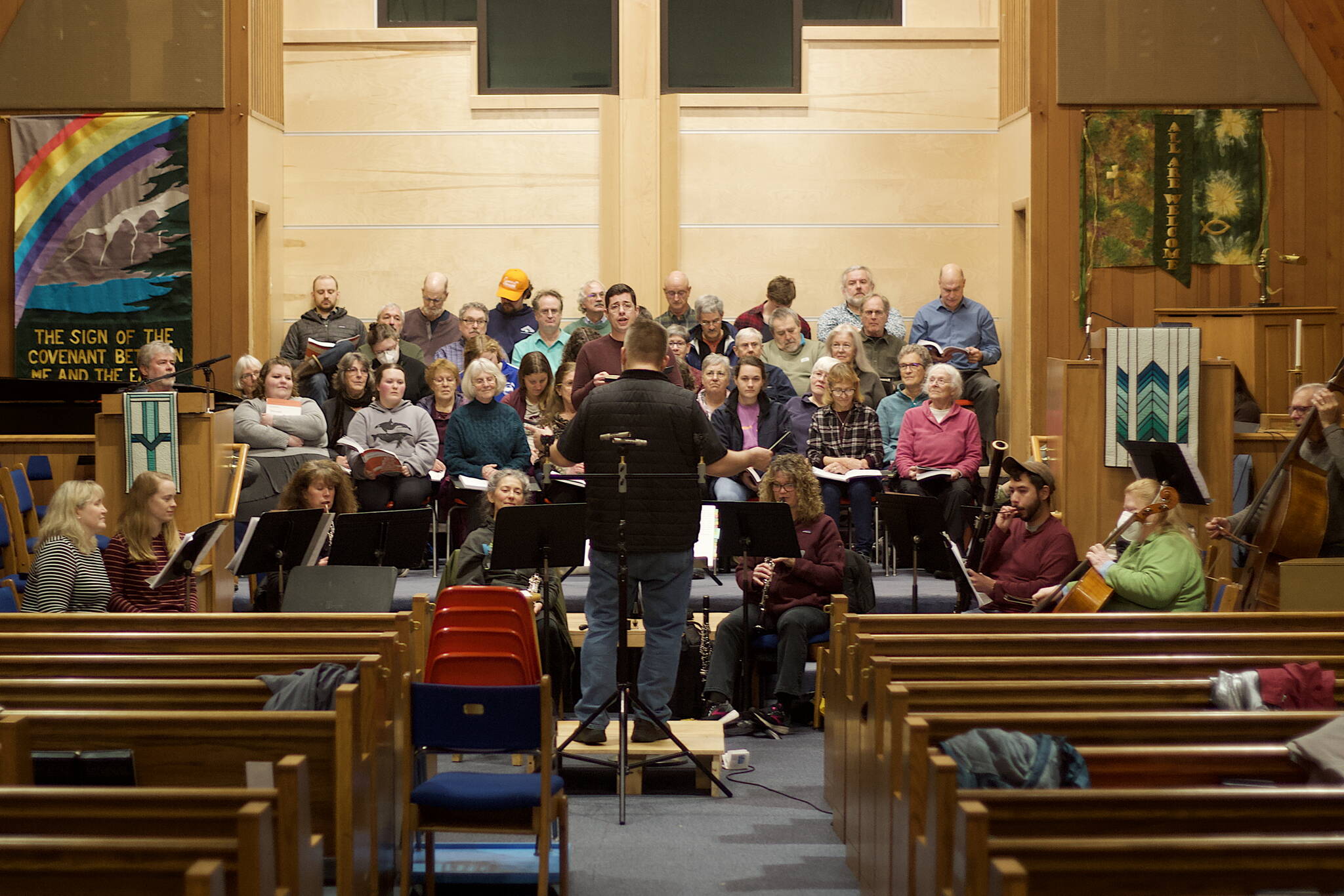Chorus members and instrumentalists rehearse a portion of Handel’s “Messiah” together for the first time on Wednesday evening at Ḵunéix̱ Hídi Northern Light United Church in preparation for concerts Saturday and Sunday. (Mark Sabbatini / Juneau Empire)