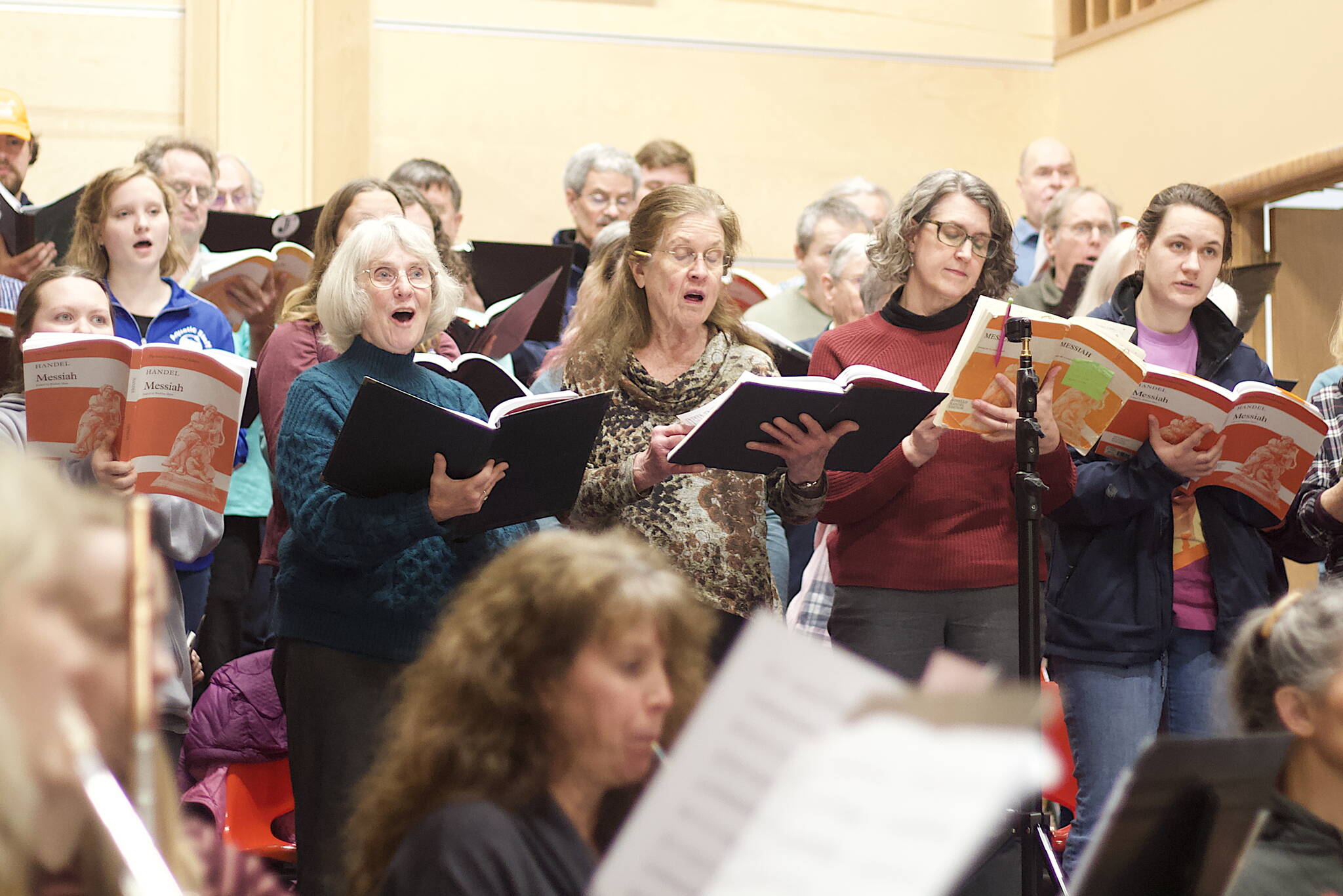 Members of the chorus rehearse a portion of Handel’s “Messiah” on Wednesday evening at Ḵunéix̱ Hídi Northern Light United Church. “Part I” and the “Hallelujah Chorus” of the oratorio are scheduled to be performed at the church at 7 p.m. Saturday and 3 p.m. Sunday. (Mark Sabbatini / Juneau Empire)