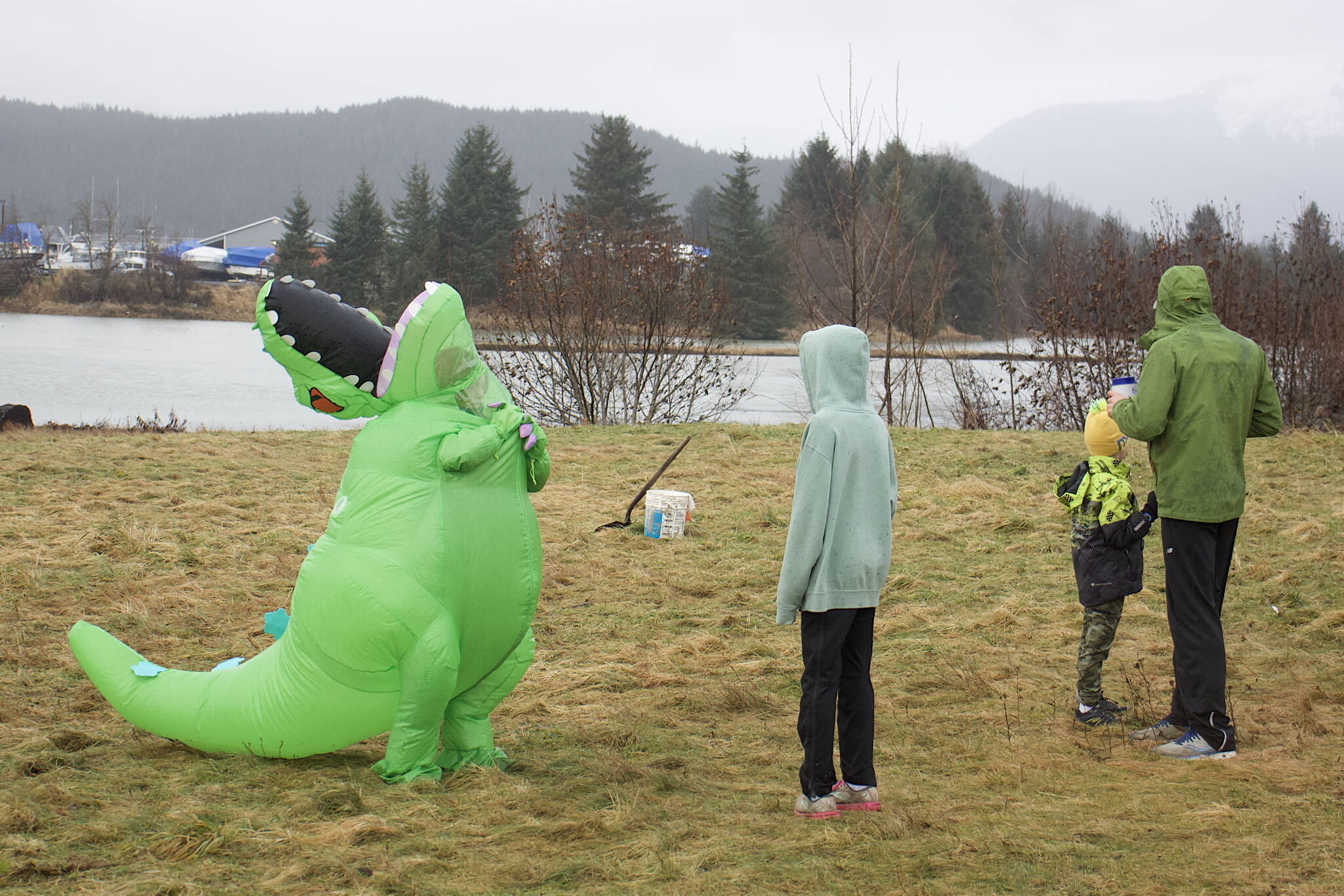 Maelee Lawrence, 11, captures the thanklessness of being an extinct species at the start/finish line of the annual Turkey Trot 5K and 1 Mile Fun Run at the Airport Dike Trail on Thursday morning. (Mark Sabbatini / Juneau Empire)