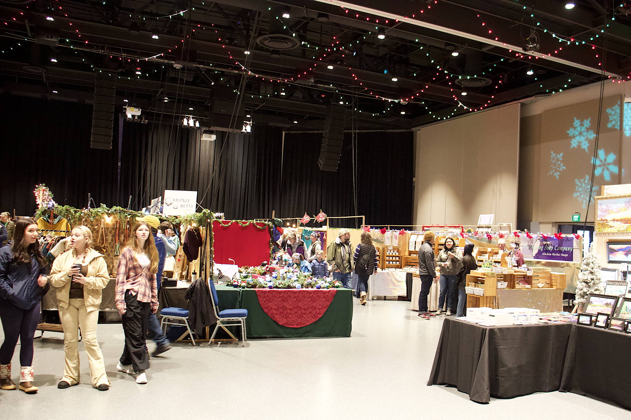The main room of Centennial Hall is filled with vendors and shoppers during the opening day of the 41st annual Juneau Public Market on Friday. (Mark Sabbatini / Juneau Empire)
