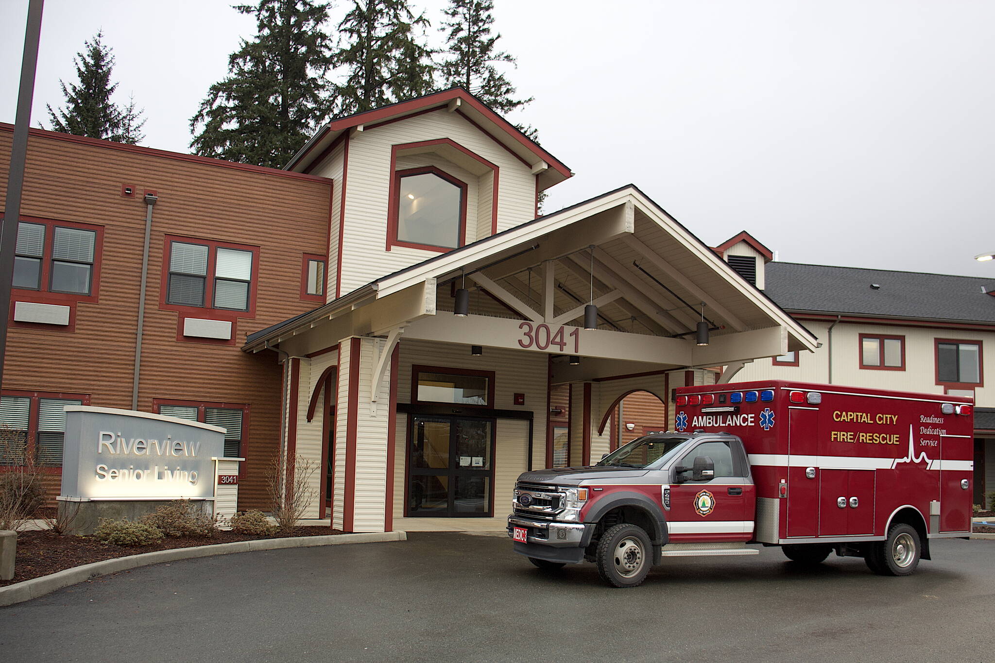 An emergency rescue vehicle parks in front of the Riverview Senior Living center at midday Monday after resident Nathan Bishop, 58, was discovered in the attic about 40 hours after he was reported missing. (Mark Sabbatini / Juneau Empire)