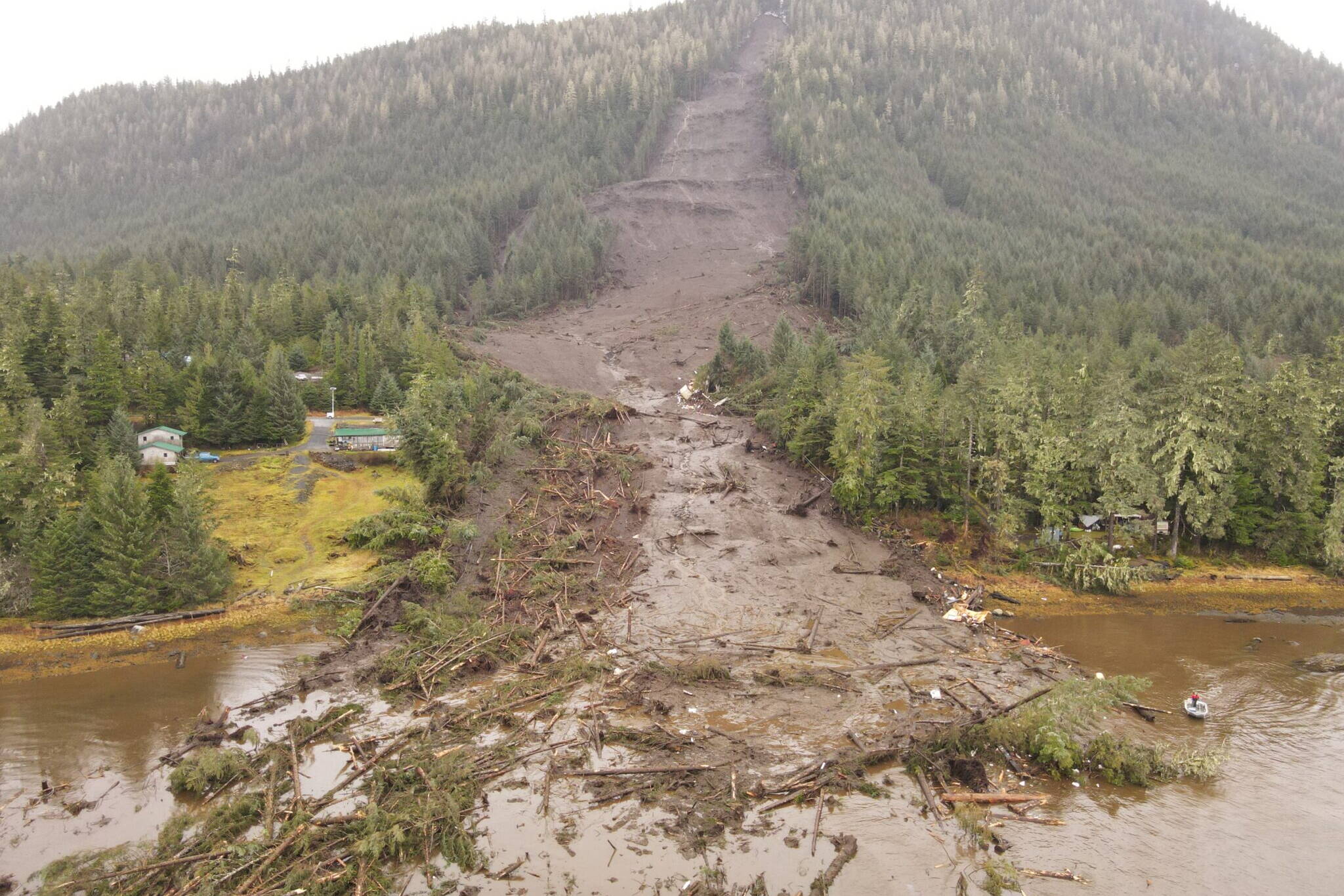 The deadly landslide that struck Wrangell on the night of Nov. 20 is seen the next day. Southeast Alaska is, by nature, vulnerable to such landslides, but climate change is adding to the risk by bringing more precipitation and more extreme rainfall events. (Photo provided by Alaska Department of Transportation and Public Facilities)