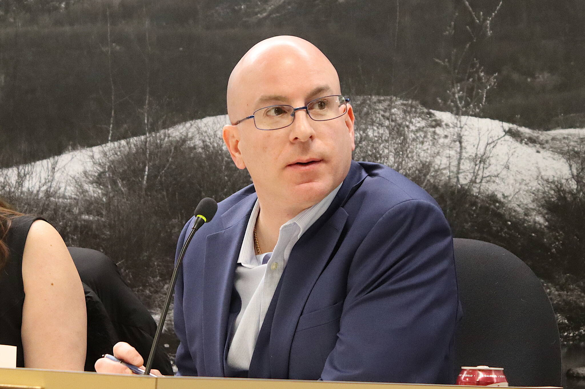 Wade Bryson, a Juneau Assembly member, explains why he favors giving local businesses a sales tax holiday for at least one day next year, targeting Feb. 29 as a suitable date, during the Assemblys Finance Committee meeting Wednesday night. The committee voted to hold onto the proposal for further study rather than sending it to the full Assembly. (Mark Sabbatini / Juneau Empire)