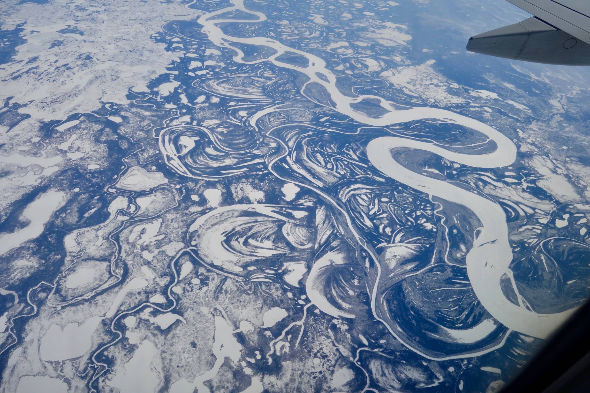 The Yukon River, seen here as a wide white band, is freezing later in fall and breaking up earlier in spring than it was a few decades ago. (Photo by Ned Rozell)