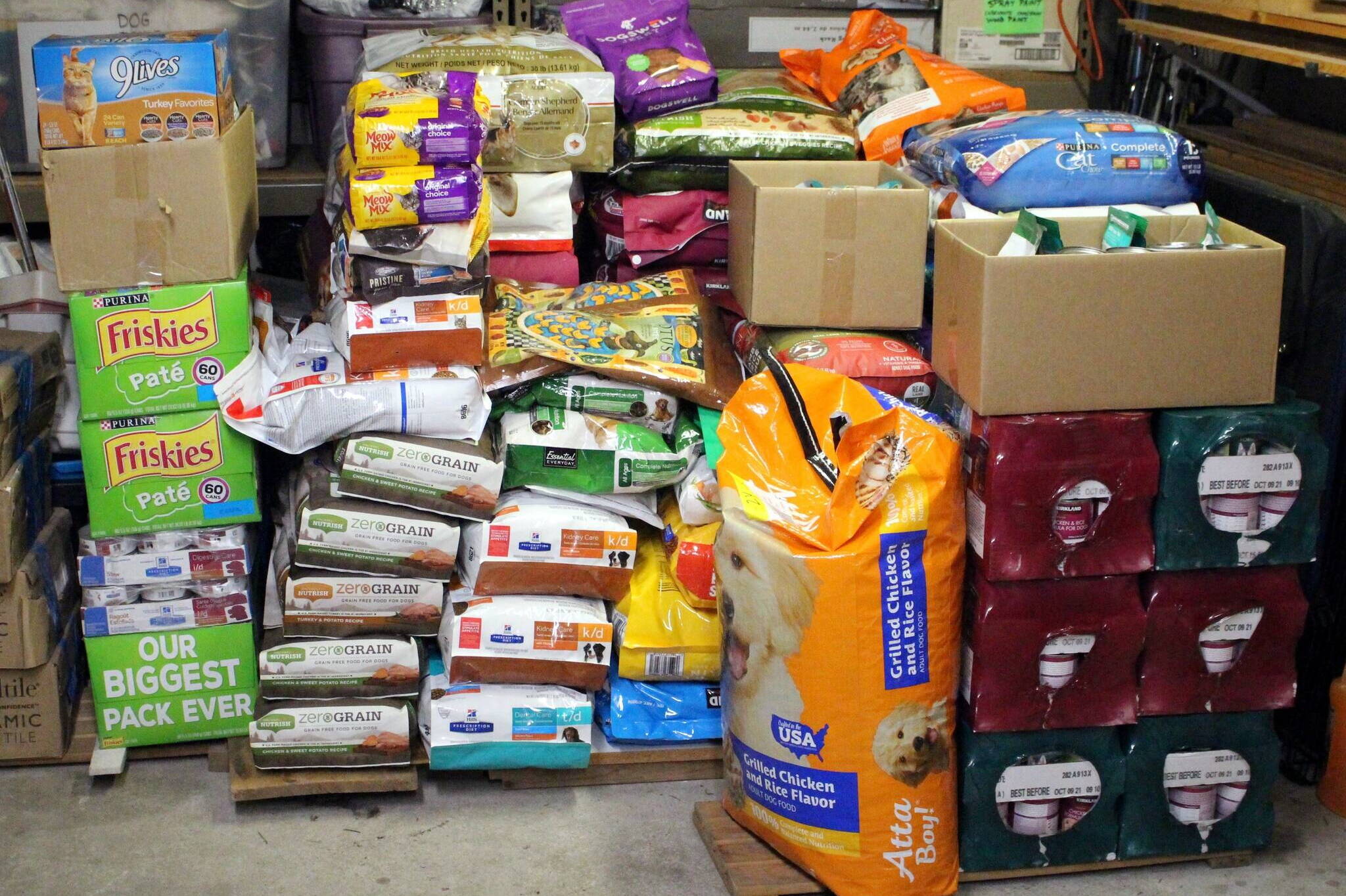 Stacks of dog and cat food sit on pallets after being donated during a previous Holiday Cat and Dog Food Drive hosted by the Grateful Dogs of Juneau. (Courtesy Photo / George Utermohle)