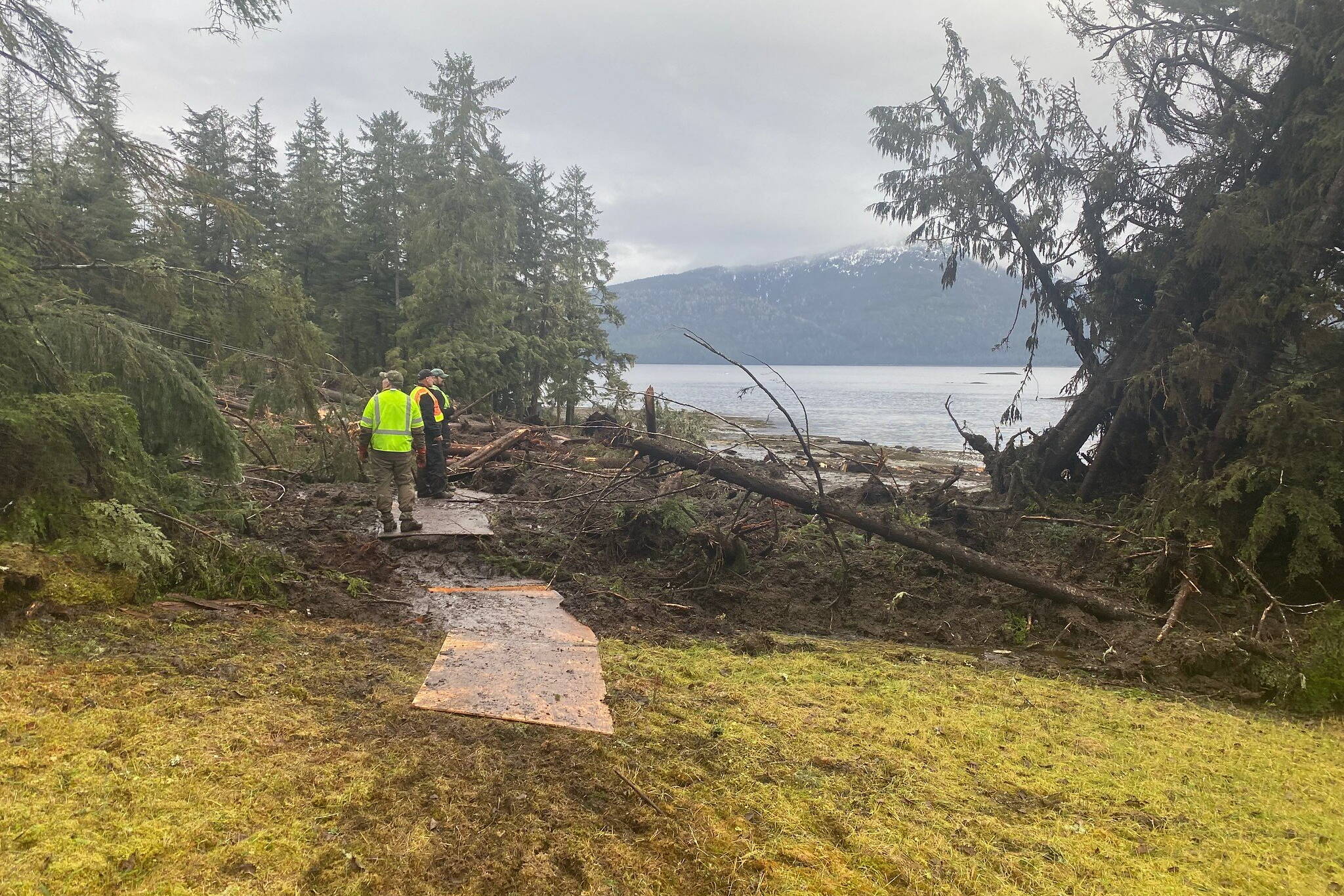 Search and rescue officials examine the area about 11 miles south of the center of Wrangell where a landslide occurred on Nov. 20. Five people are confirmed dead from the landslide and one still missing. (Photo courtesy of Alaska Department of Public Safety)