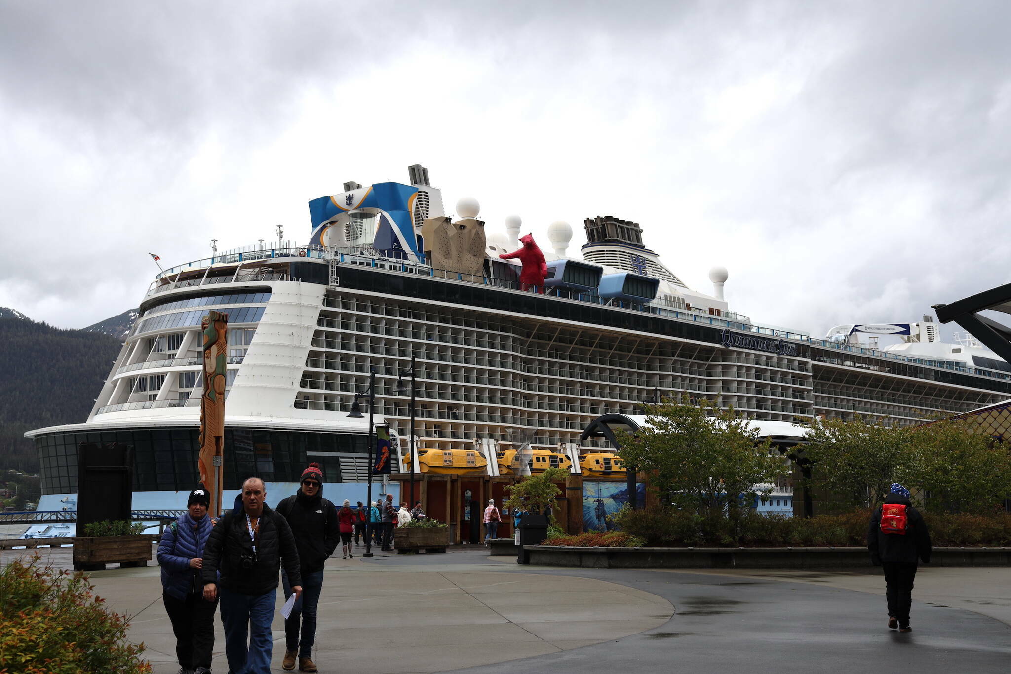 Cruise ship passengers walk around in downtown Juneau in late May. (Clarise Larson / Juneau Empire file photo)