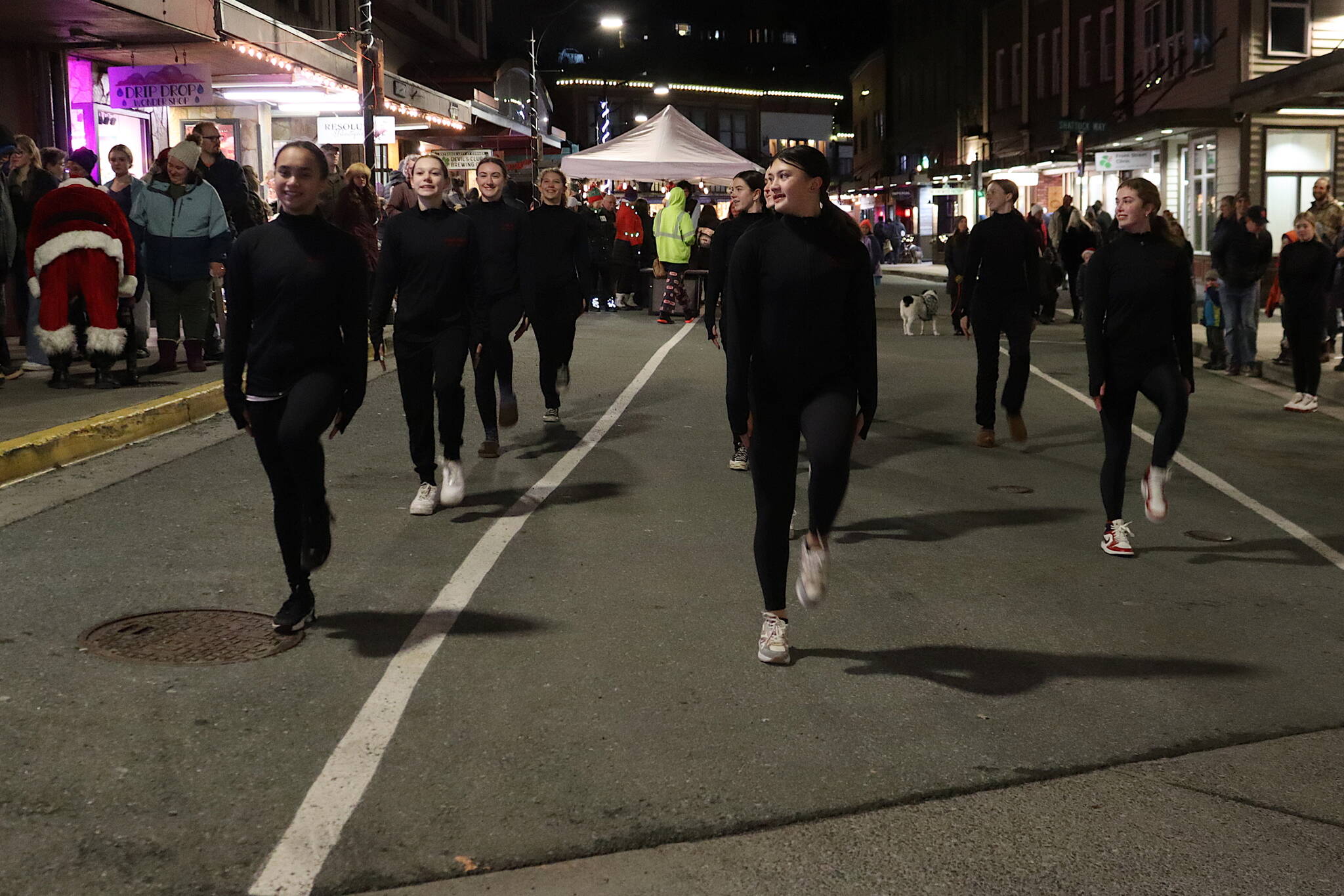 The Juneau-Douglas High School: Yadaa.at Kalé drill team performs a routine on Front Street during Gallery Walk on Friday night. (Mark Sabbatini / Juneau Empire)