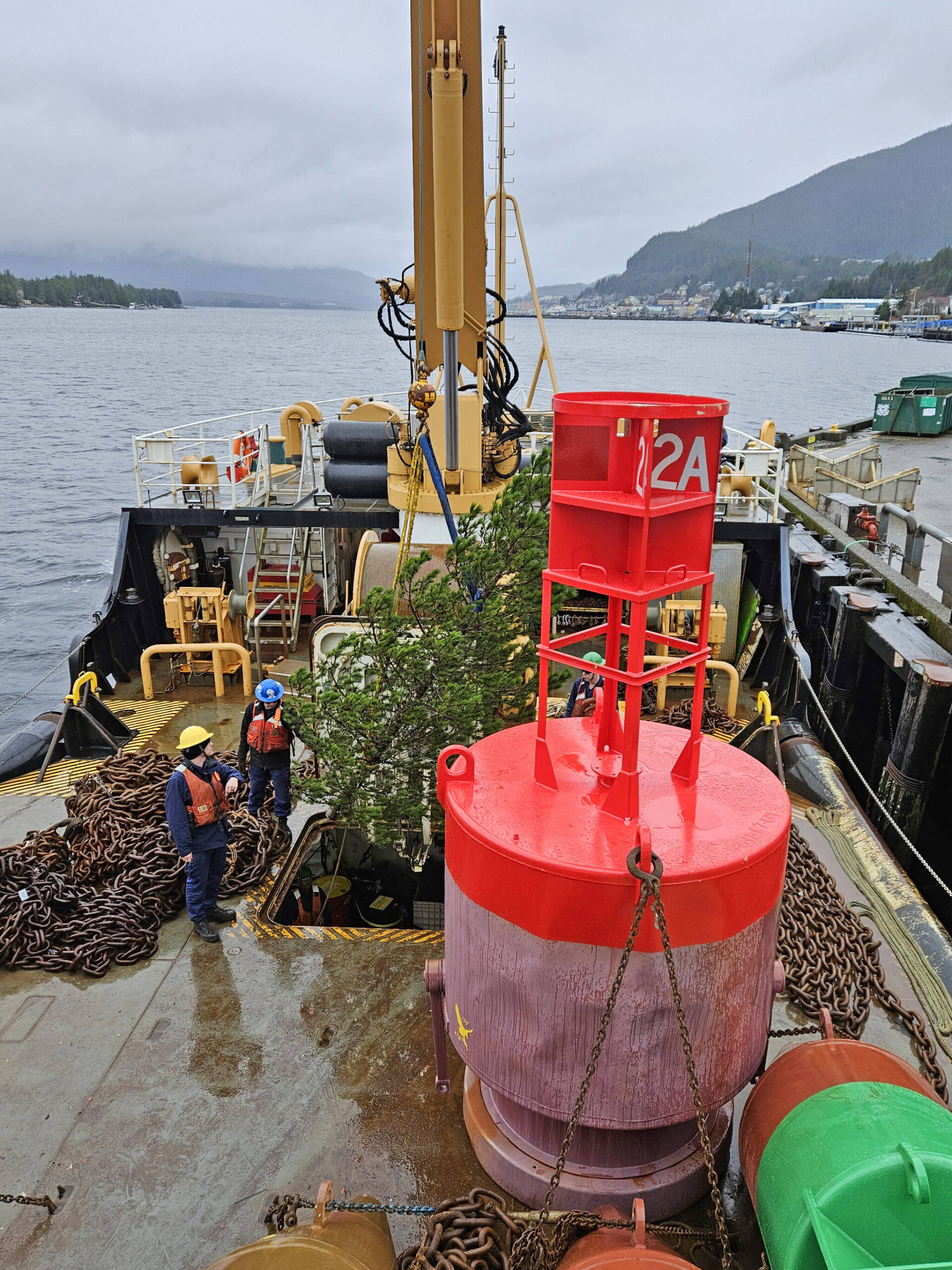 A 15-foot-long lodgepole pine destined for the governor’s mansion in Juneau is secured aboard the U.S. Coast Guard vessel Anthony Petit on Nov. 30. (Photo courtesy of the U.S. Forest Service)