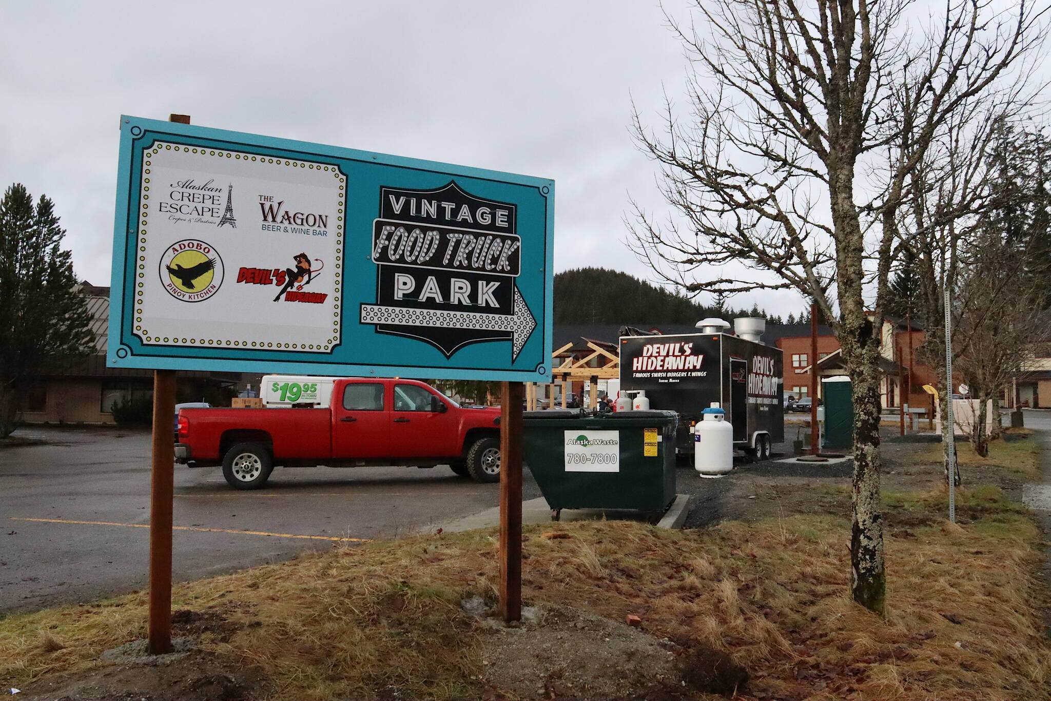 A sign on Wednesday greets people at an entrance to the new Vintage Food Truck Park, which opened on Dec. 1 with two of the eventual five trucks planned for the site. (Mark Sabbatini / Juneau Empire)