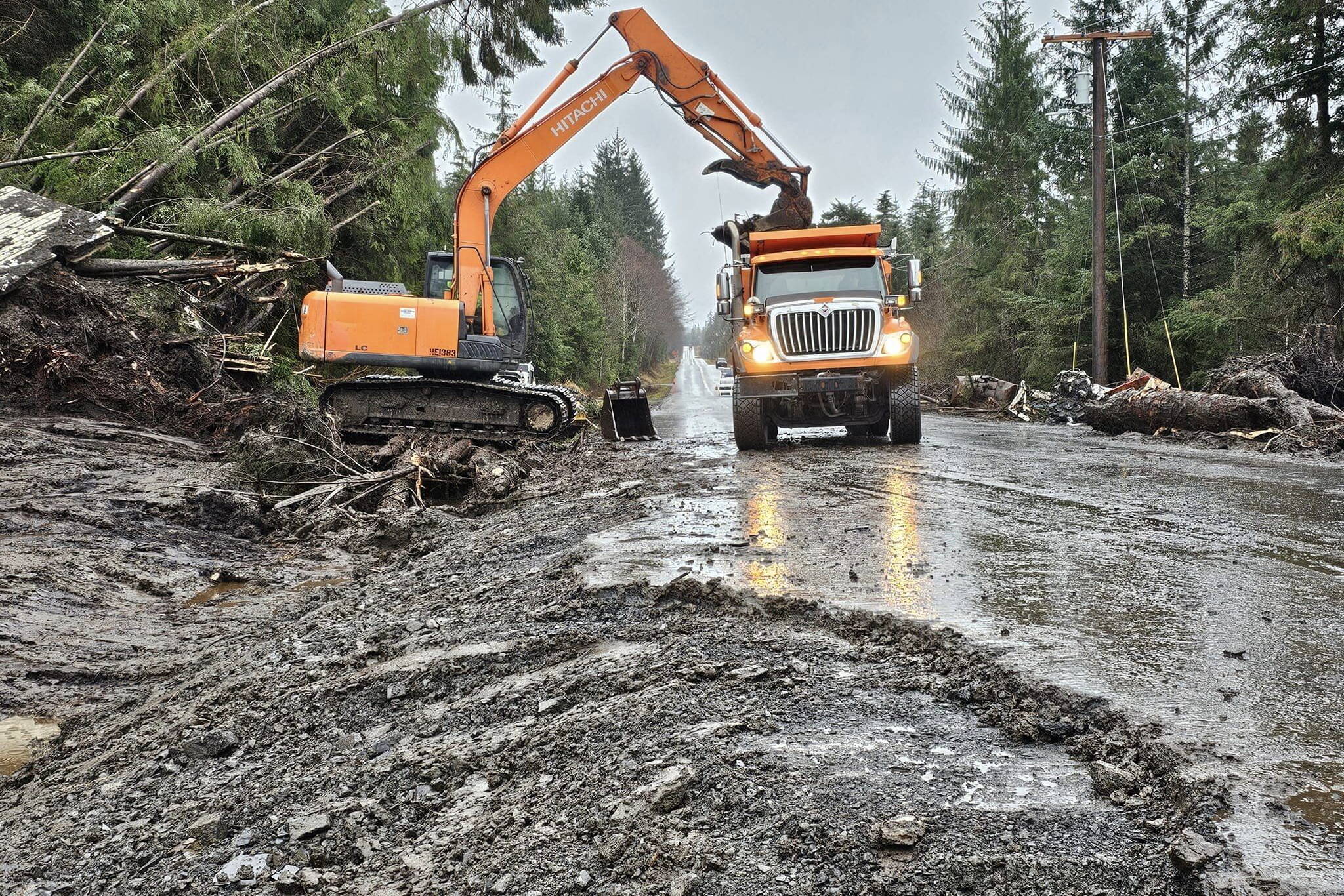 Work crews continue removing hundreds of truckloads of debris from Zimovia Highway since the Nov. 20 landslide in Wrangell. (Photo courtesy of the Alaska Department of Transportation and Public Facilities)