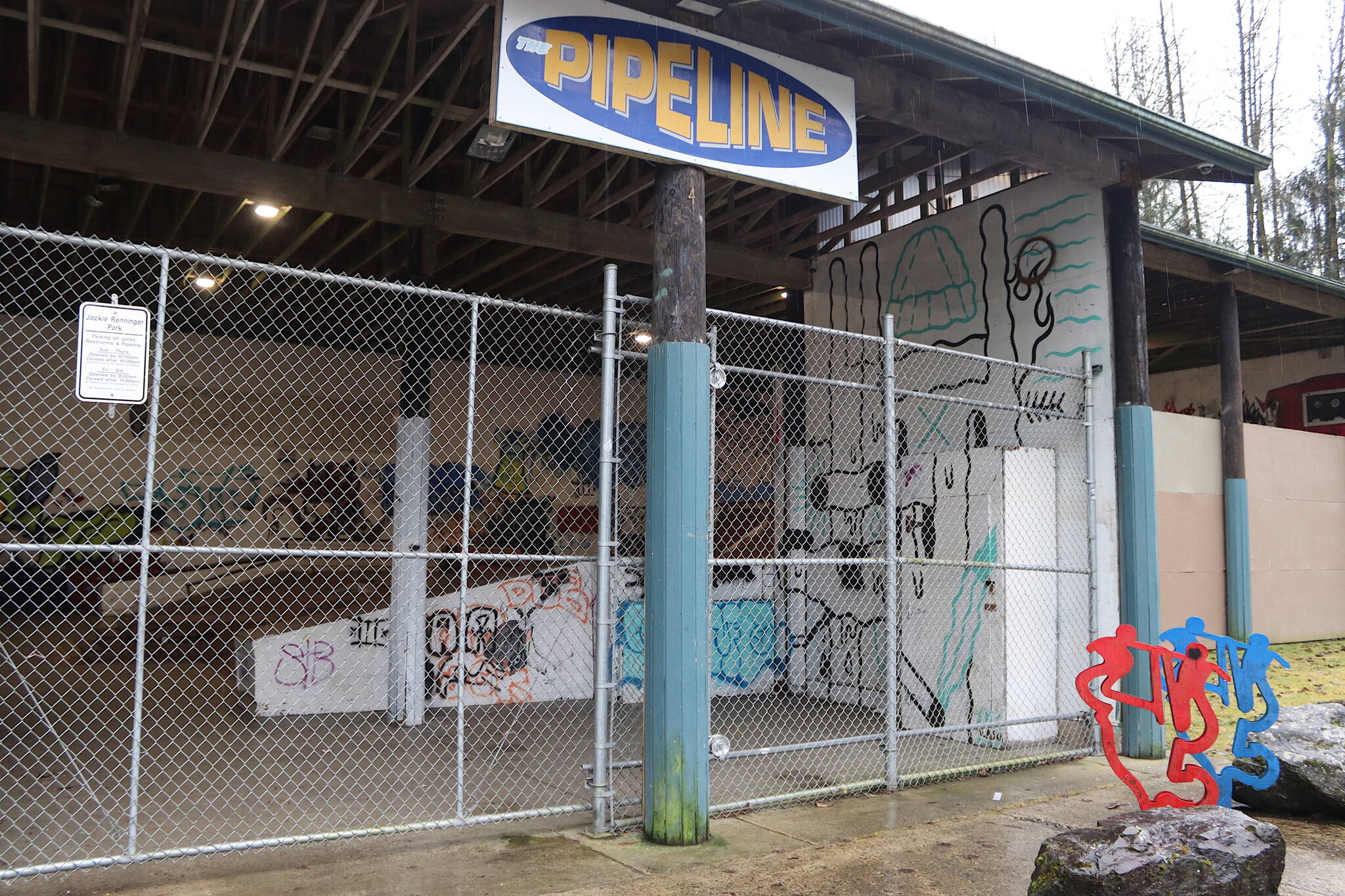 The gates are locked at the Pipeline Skate Park at midday Thursday, after Juneau’s Parks and Recreation Department announced the facility will be open limited hours until further notice due to an increase in vandalism and drug paraphernalia. (Mark Sabbatini / Juneau Empire)