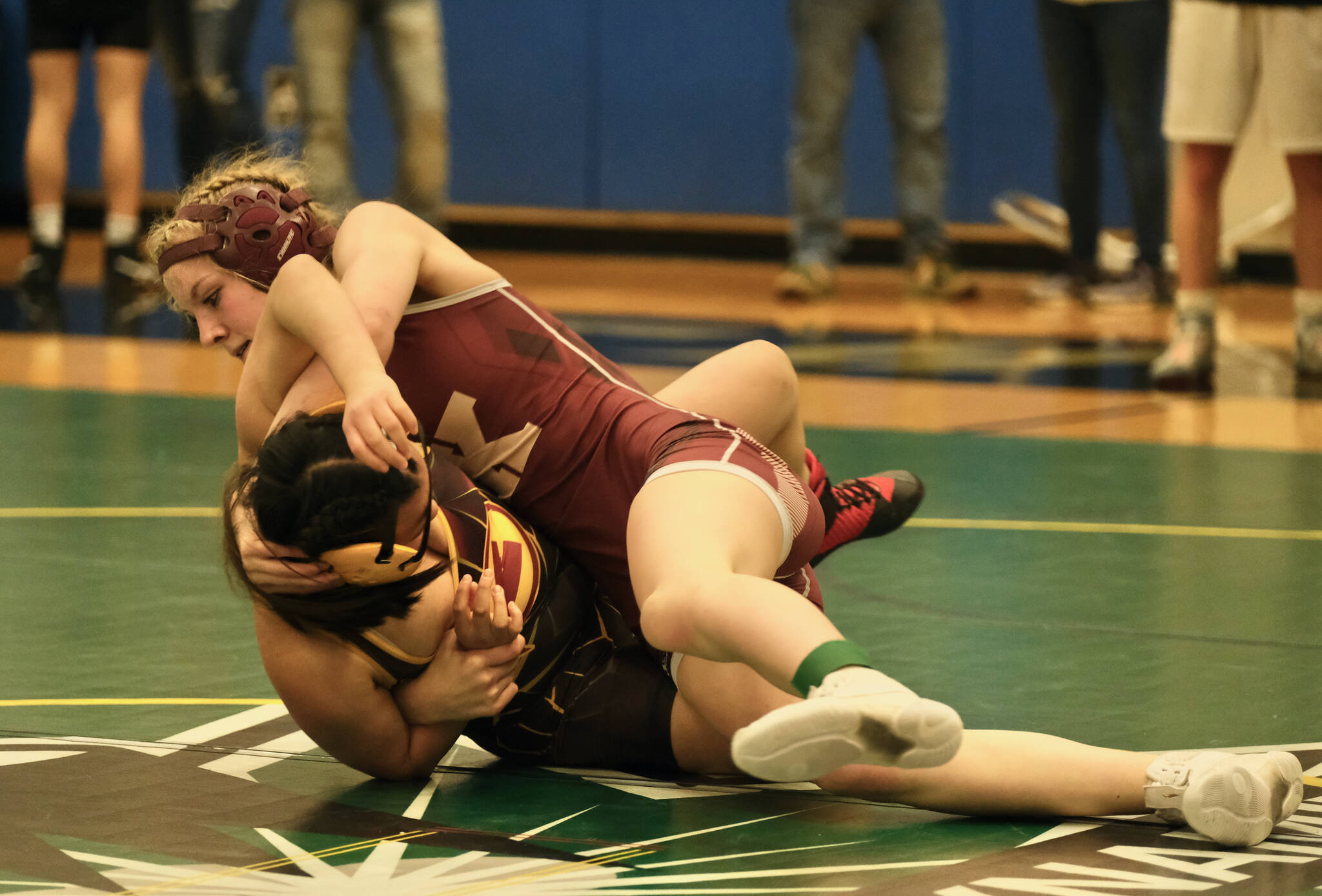 Ketchikan sophomore Summer Boling puts Mt. Edgecumbe freshman Andrea Westdahl on her back during their girl’s 120-pound opening round match of the 2023 Region V Wrestling Championships on Friday at Thunder Mountain High School. Boling won by fall. (Klas Stolpe / For the Juneau Empire)