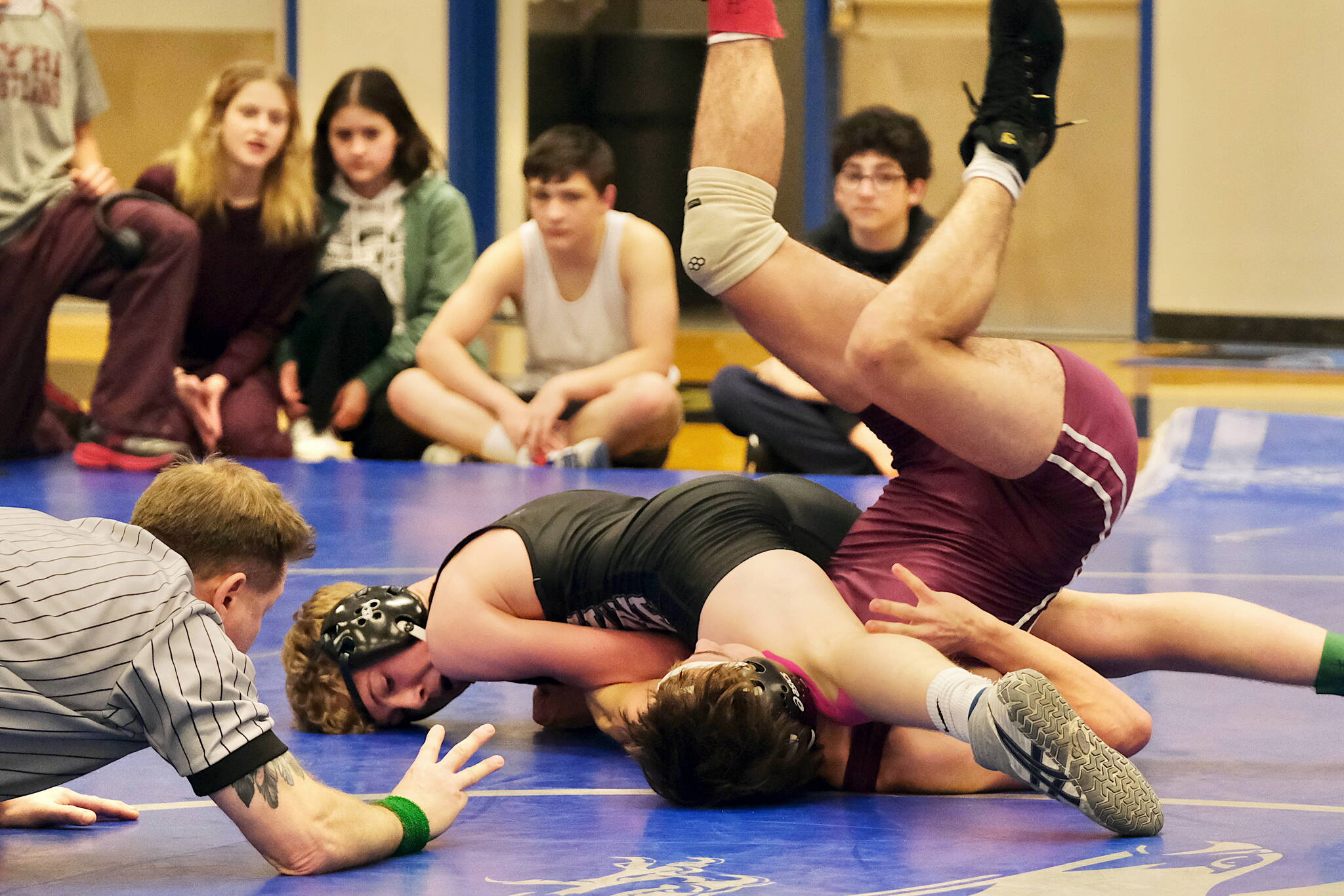 Thunder Mountain High School junior Sage Schultz pins Ketchikan senior Alexander Gilley in their 135-pound semifinal match of the 2023 Region V Wrestling Championships on Friday at TMHS. (Klas Stolpe / For the Juneau Empire)