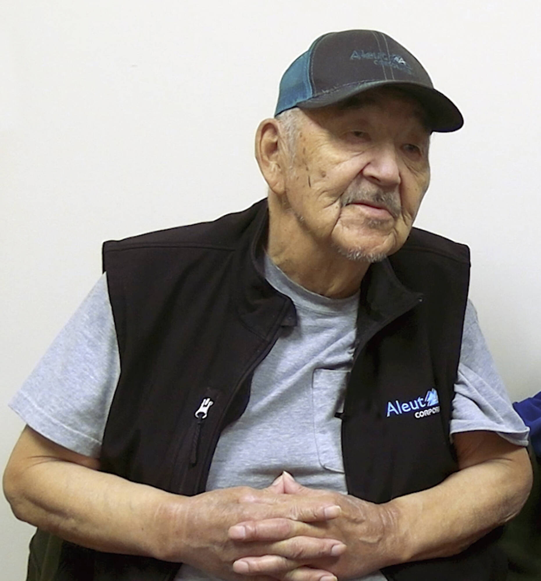 In this photo provided by Aleutian Pribilof Islands Association, Inc., Gregory Golodoff takes part in an interview, April 26, 2023, at the association’s office in Anchorage, Alaska. Golodoff, who died on Nov. 17, 2023, was the last living resident of Attu, Alaska, whose residents were captured by the Japanese in World War II. Residents were interned in Japan during the war, and most resettled in Atka, Alaska, after the war concluded. (Chrissy Roes/Aleutian Pribilof Islands Association, Inc. via AP)