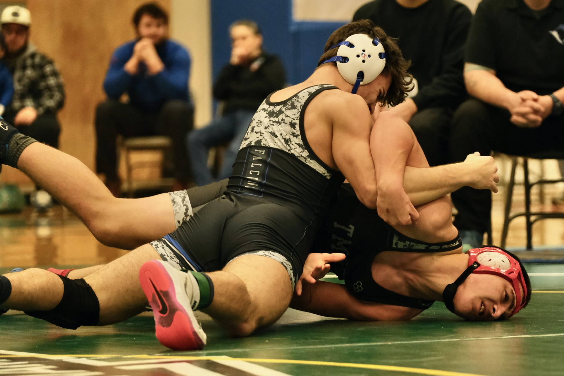 Thunder Mountain High School junior Justus Darbonne works to turn TMHS sophomore Alex Marx-Beierly in the 152-pound Division I championship match of the 2023 ASAA Region V wrestling tournament Saturday at TMHS. Darbonne won by 12-1 major decision. (Klas Stolpe/ For the Juneau Empire)
