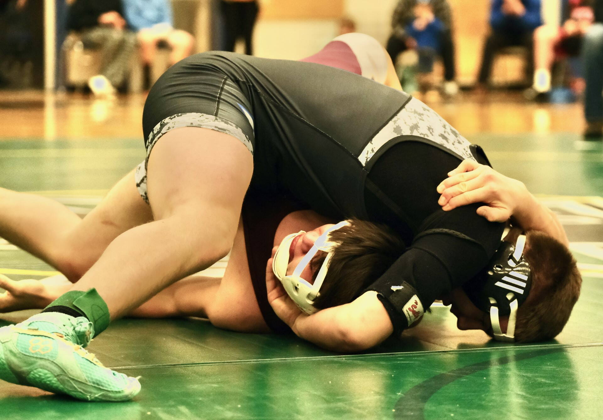 Thunder Mountain High School junior Carvin Hass attempts to pin Ketchikan High School sophomore Amook Bullock in the 160-pound Division I championship match of the 2023 ASAA Region V wrestling tournament Saturday at TMHS. Hass won by fall. (Klas Stolpe/ For the Juneau Empire)