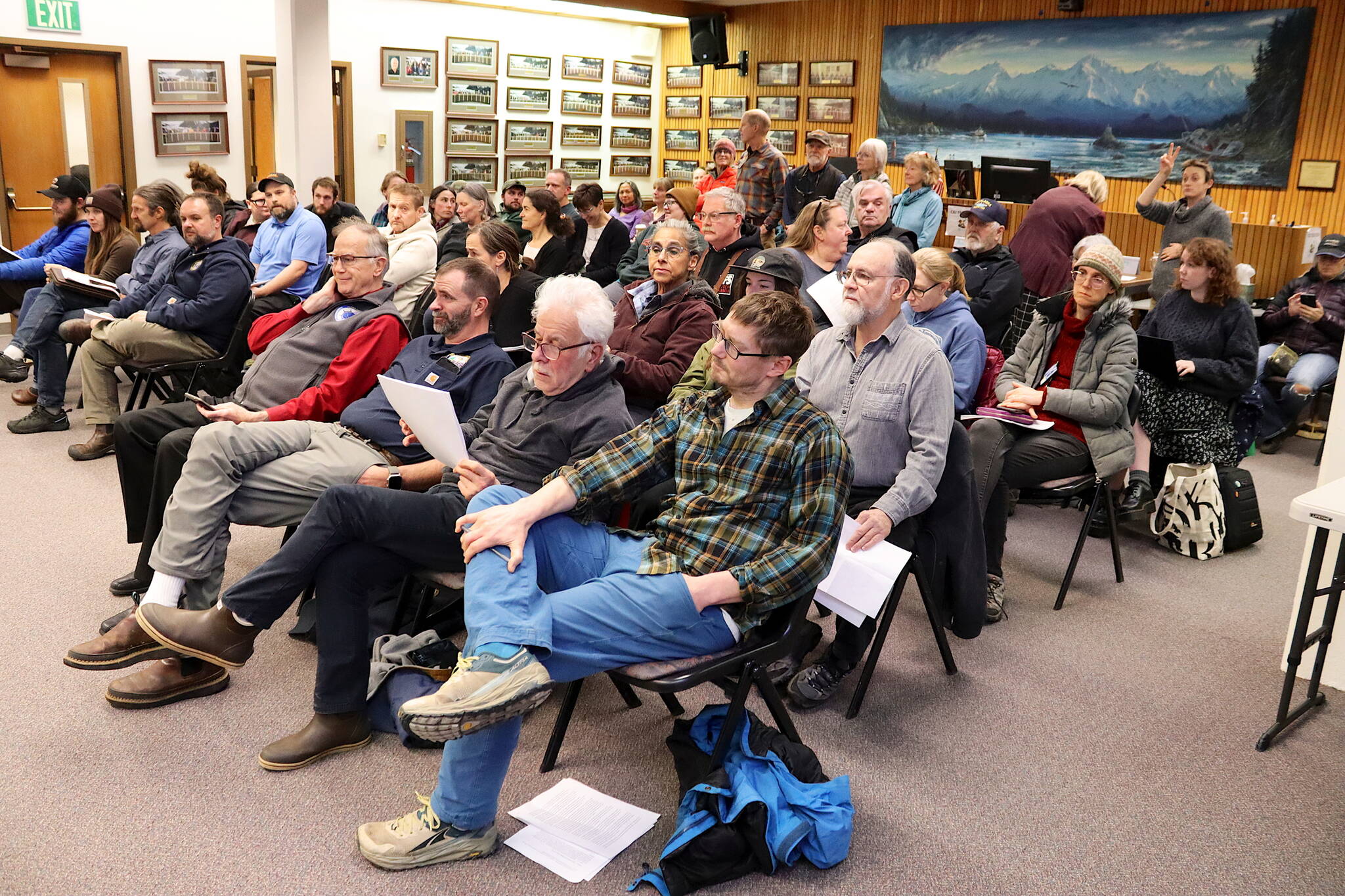 Dozens of people fill the Assembly chambers to testify during a Juneau Assembly meeting on Monday night. Most of the people spoke about either a proposed municipal compost facility, or an ordinance updating landslide and avalanche zone maps. (Mark Sabbatini / Juneau Empire)