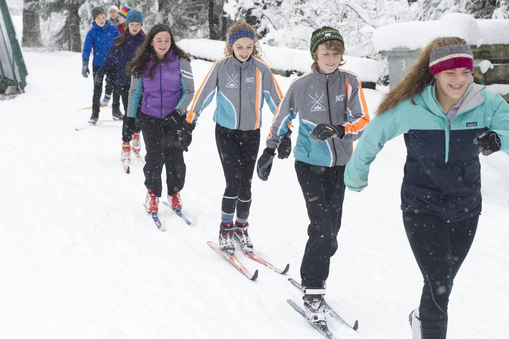 Juneau Nordic Ski Team members Erin Wallace, front, leads Aaron Blust and Anna Iverson in a pole-less skiing drill through fresh snow on Saturday, Nov. 18, 2017, at the Mendenhall Campgrounds. The team has been granted interim high school “club” status to compete in the Alaska School Activities Association’s state championship for the first time in many years in February. (Nolin Ainsworth / Juneau Empire file photo)
