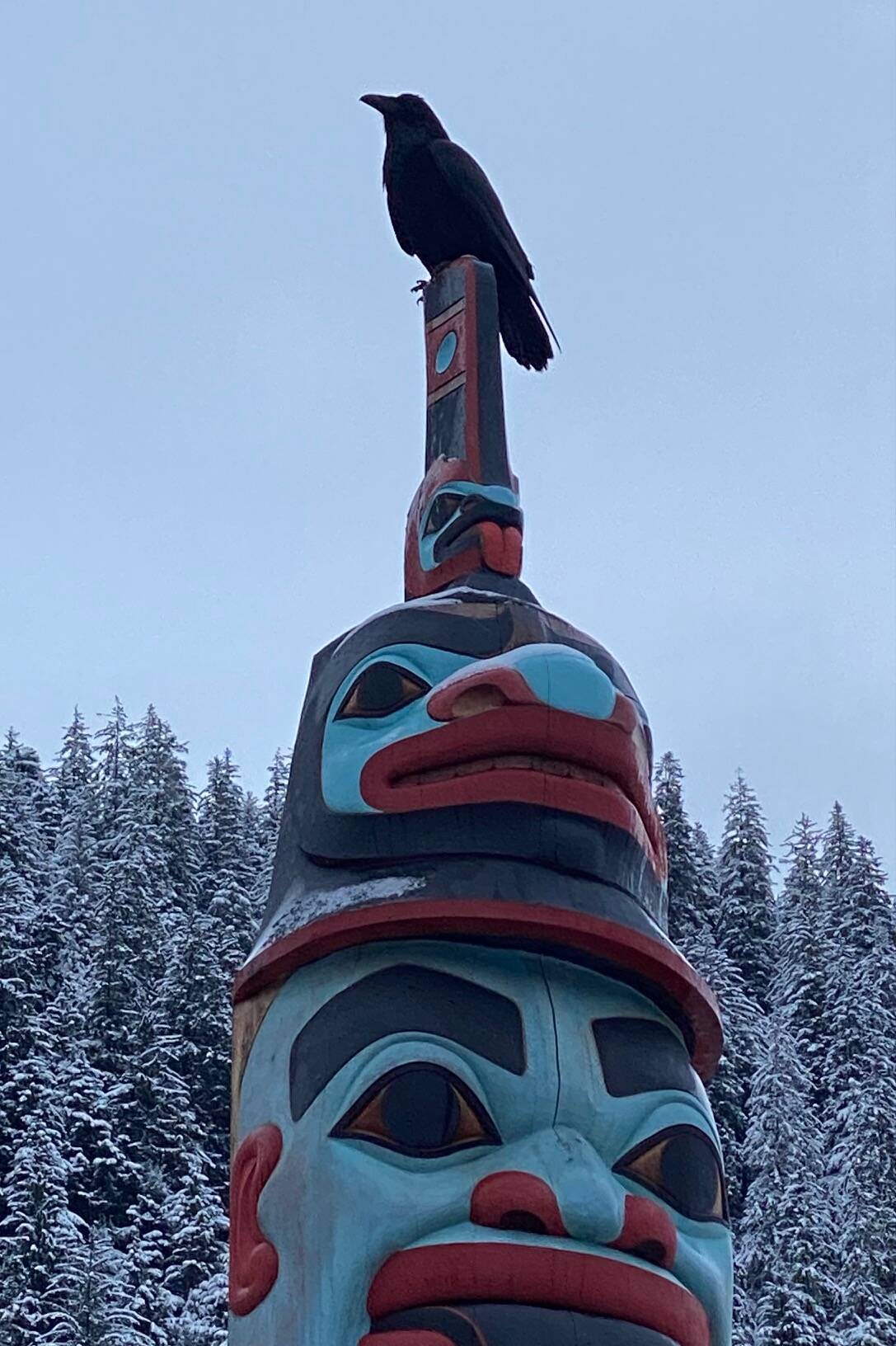 Raven becomes part of a Seawalk totem on Dec. 10. (Photo by Denise Carroll)