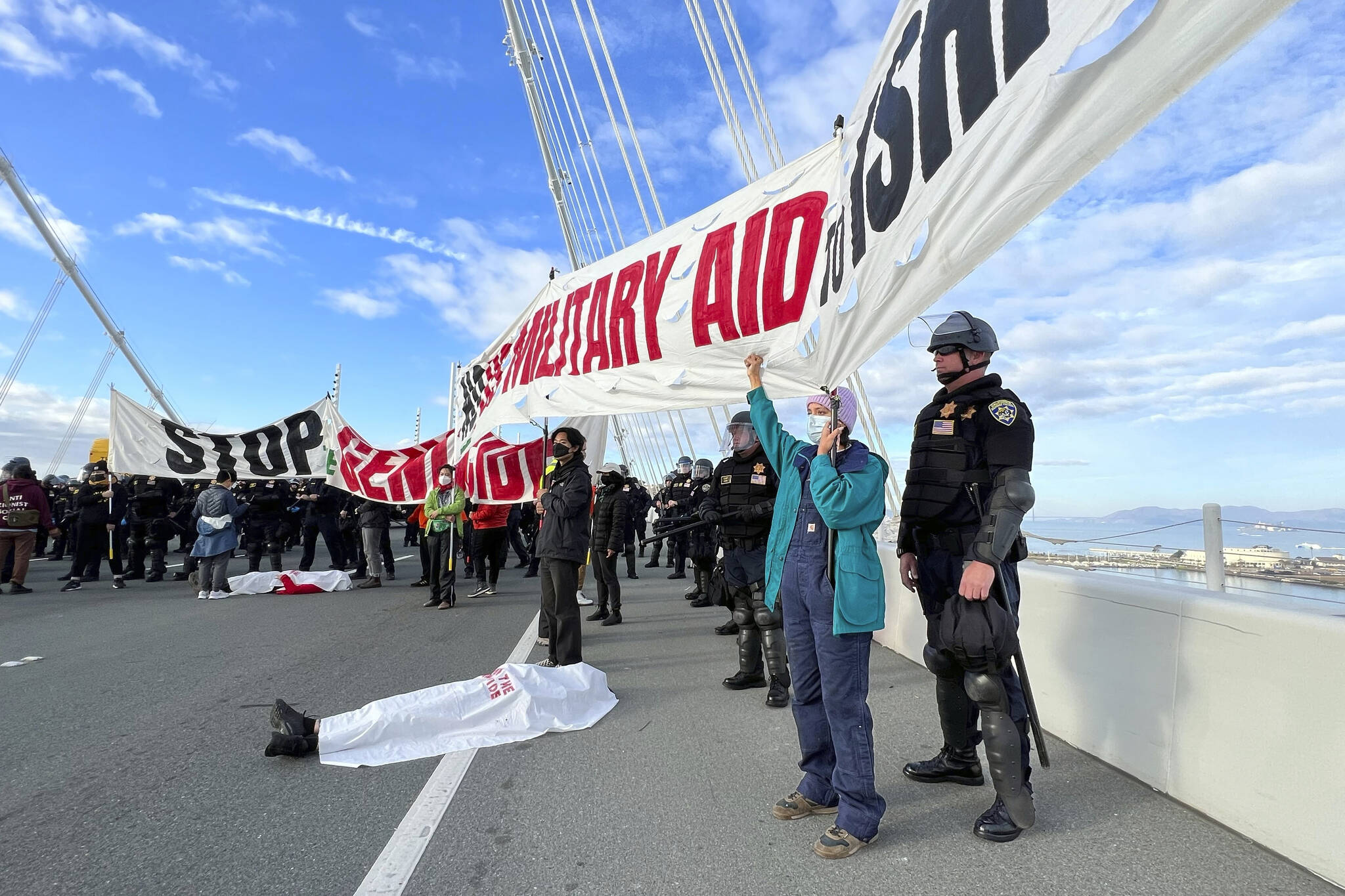 Demonstrators shut down the San Francisco Oakland Bay Bridge in conjunction with the APEC Summit taking place Thursday, Nov. 16, in San Francisco. San Francisco’s District Attorney’s Office on Monday began charging demonstrators who blocked traffic for hours last month on the Bay Bridge to demand a cease-fire in Gaza. (AP Photo/Noah Berger, File)
