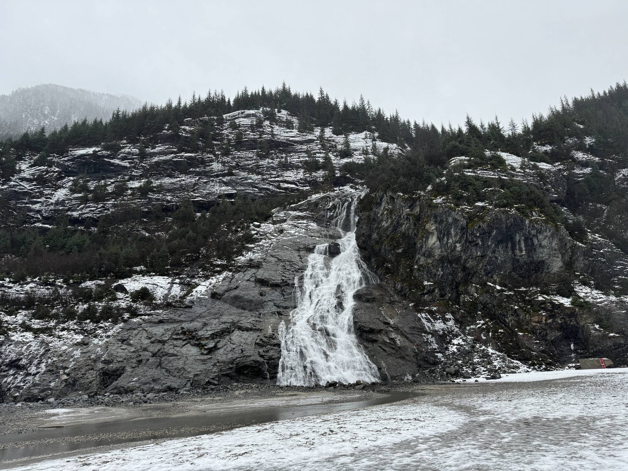 A waterfall continues to flow in full force along the Nugget Falls Trail on Dec. 24. (Photo by Deana Barajas)