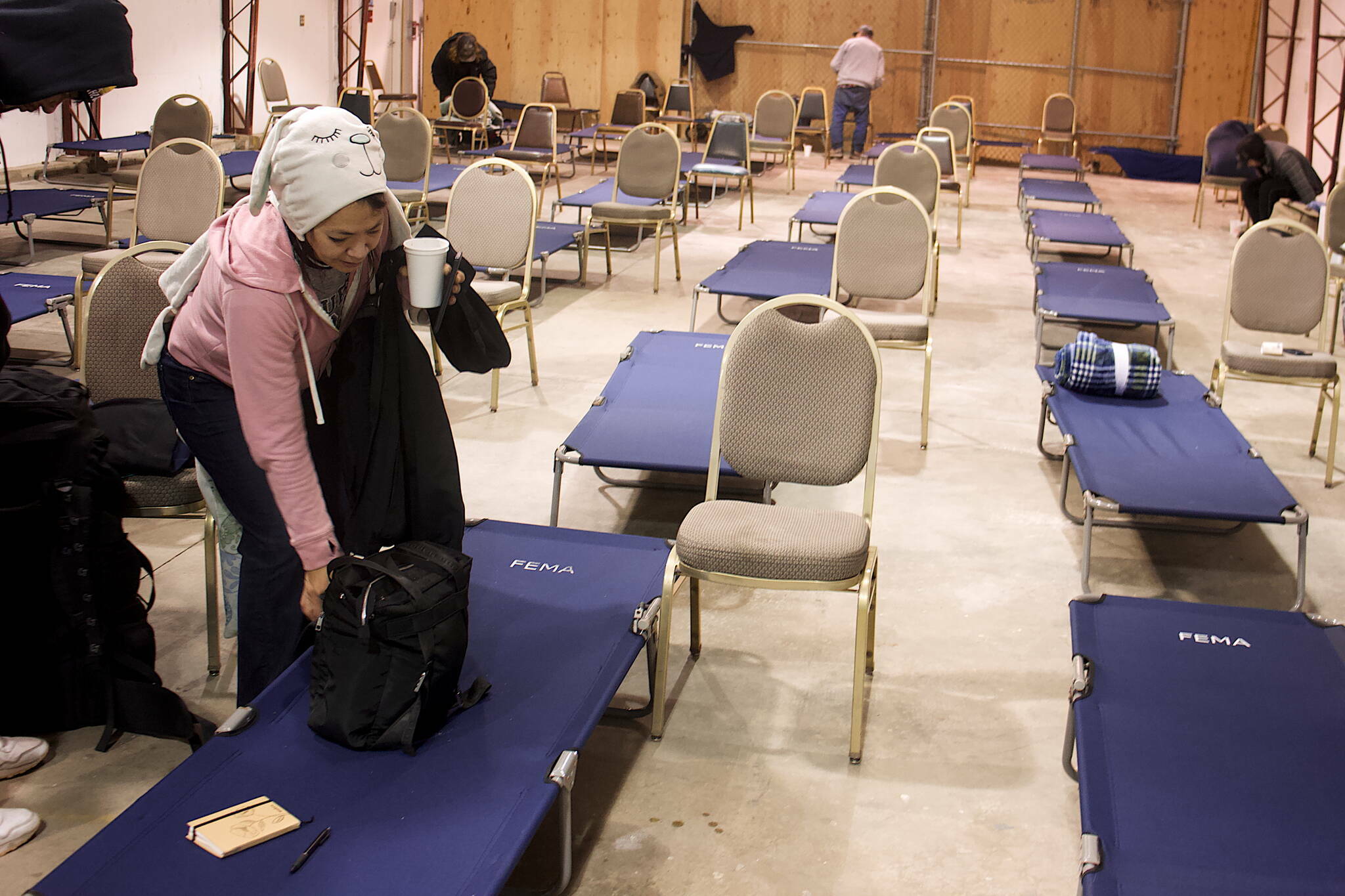 Melody Beierly packs her belongings Saturday, Oct. 21, after spending her first night at the city’s new cold weather emergency shelter. (Mark Sabbatini / Juneau Empire file photo)