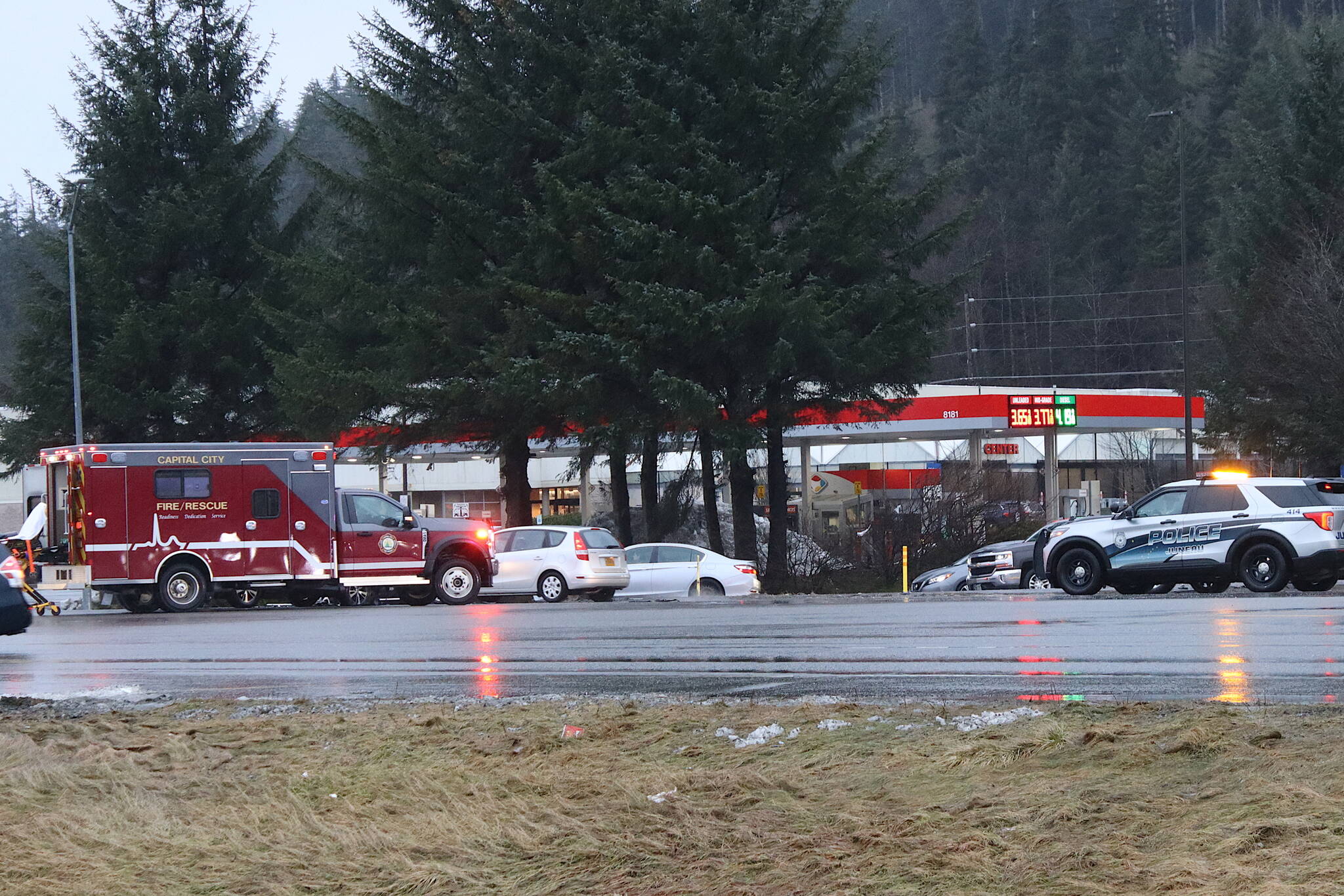 Police and fire officials respond to an injury accident at the Fred Meyer intersection on Saturday, Dec. 23. Limited safety improvements at the intersection scheduled for completion by Oct. 31 have not been finished due to supply chain and other issues, according to a state transportation department spokesperson. (Mark Sabbatini / Juneau Empire)