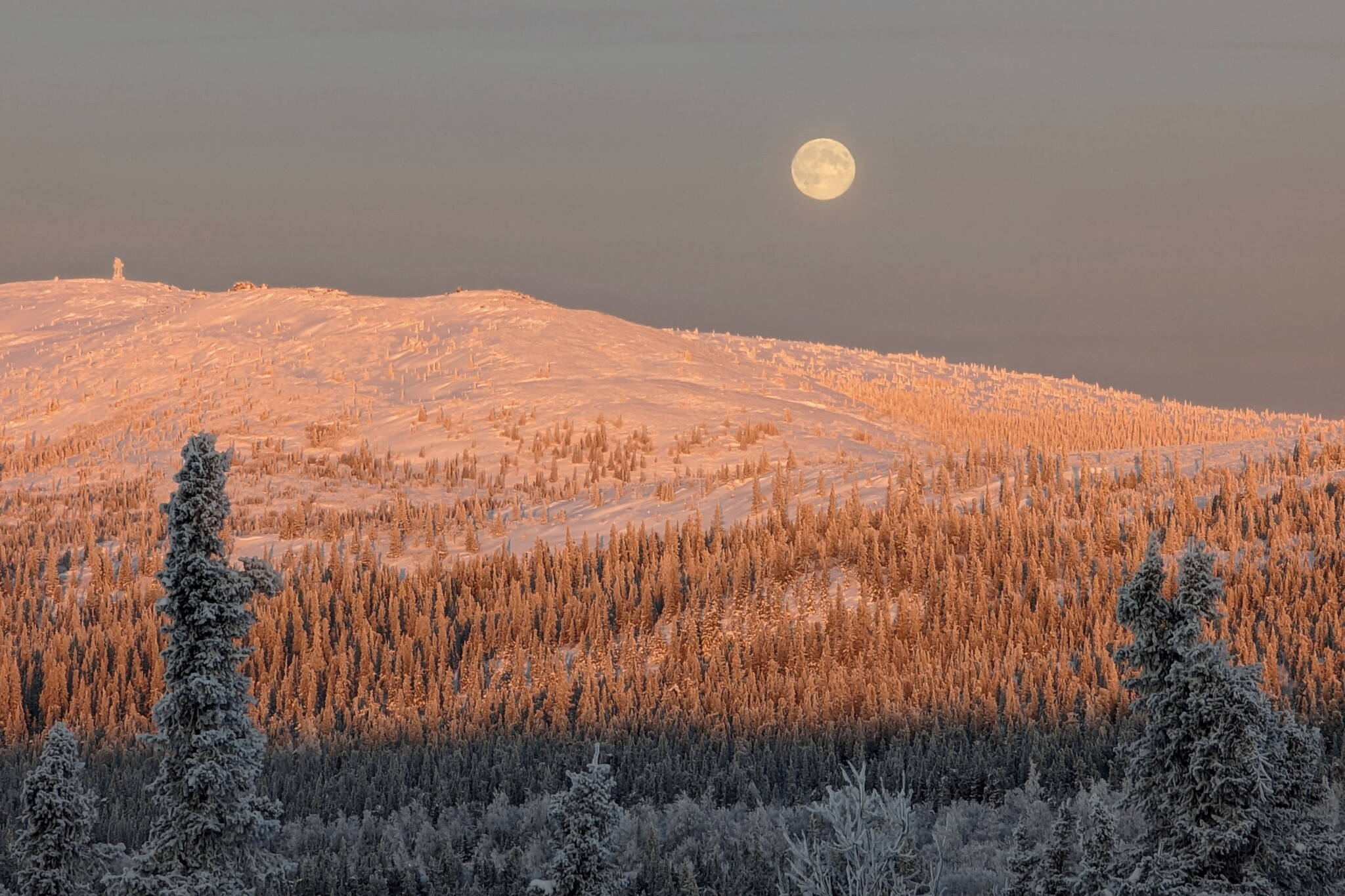 John Eichelberger of Fairbanks took this photo of the full moon on Dec. 26 north of Fairbanks. At the time he took this photo — solar noon in Fairbanks or about 1 p.m. local time — the full moon appeared due north of him. (Photo by John Eichelberger)