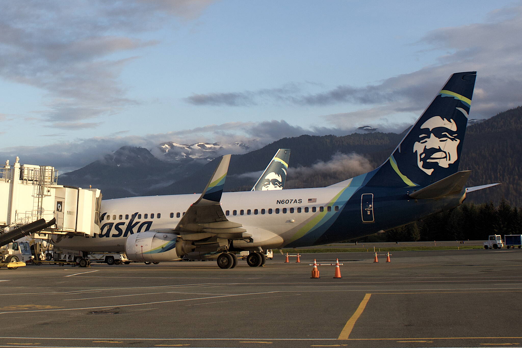 Alaska Airlines planes park at the gates at Juneau International Airport in July of 2022. (Mark Sabbatini / Juneau Empire file photo)