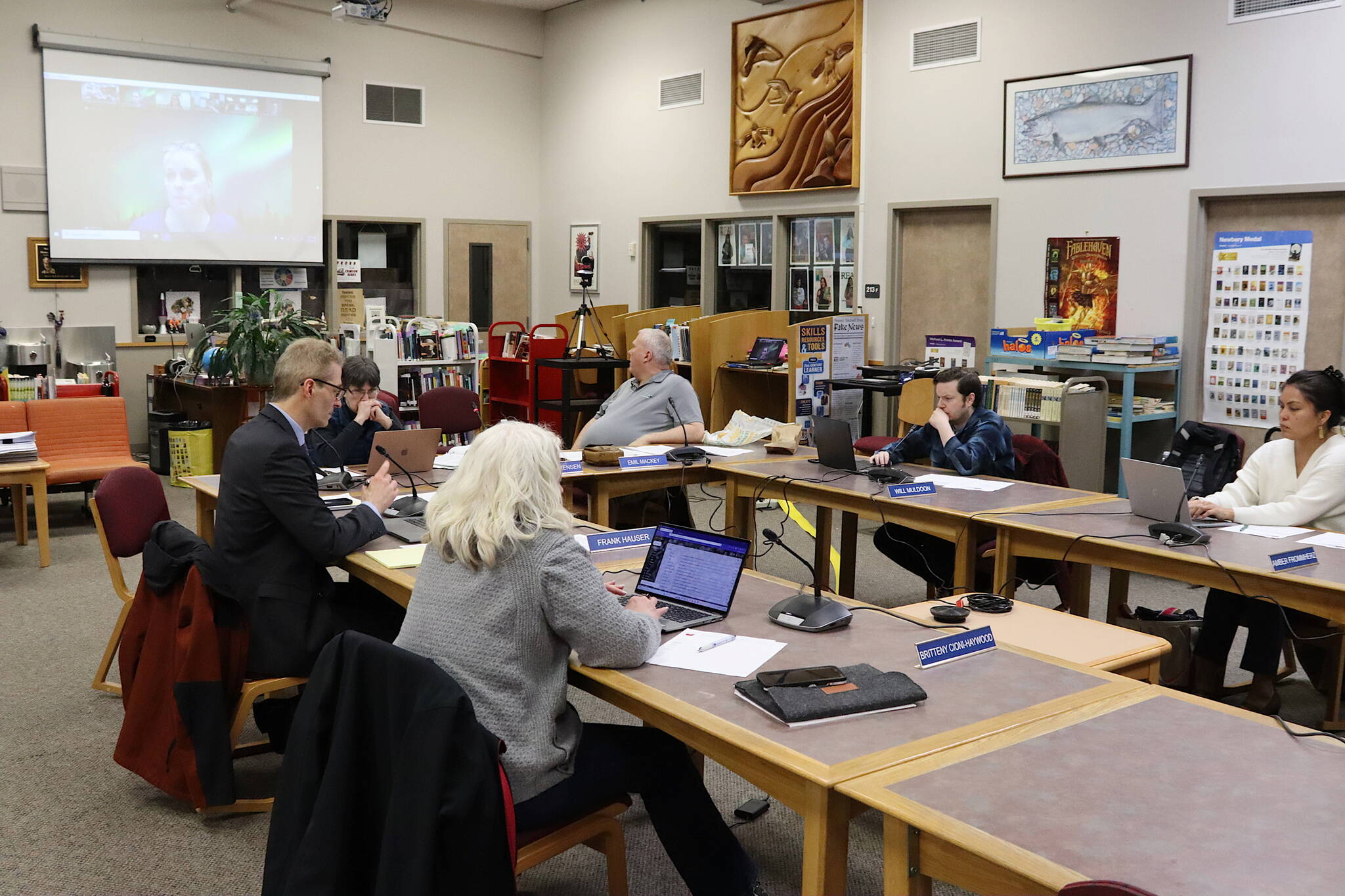 Juneau School District administrators and board members listen Tuesday to a remote presentation by Lisa Pearce, hired as a budget expert in December, about how her analysis during the past few weeks revealed a $9.5 million deficit facing the district this fiscal year. (Mark Sabbatini / Juneau Empire)