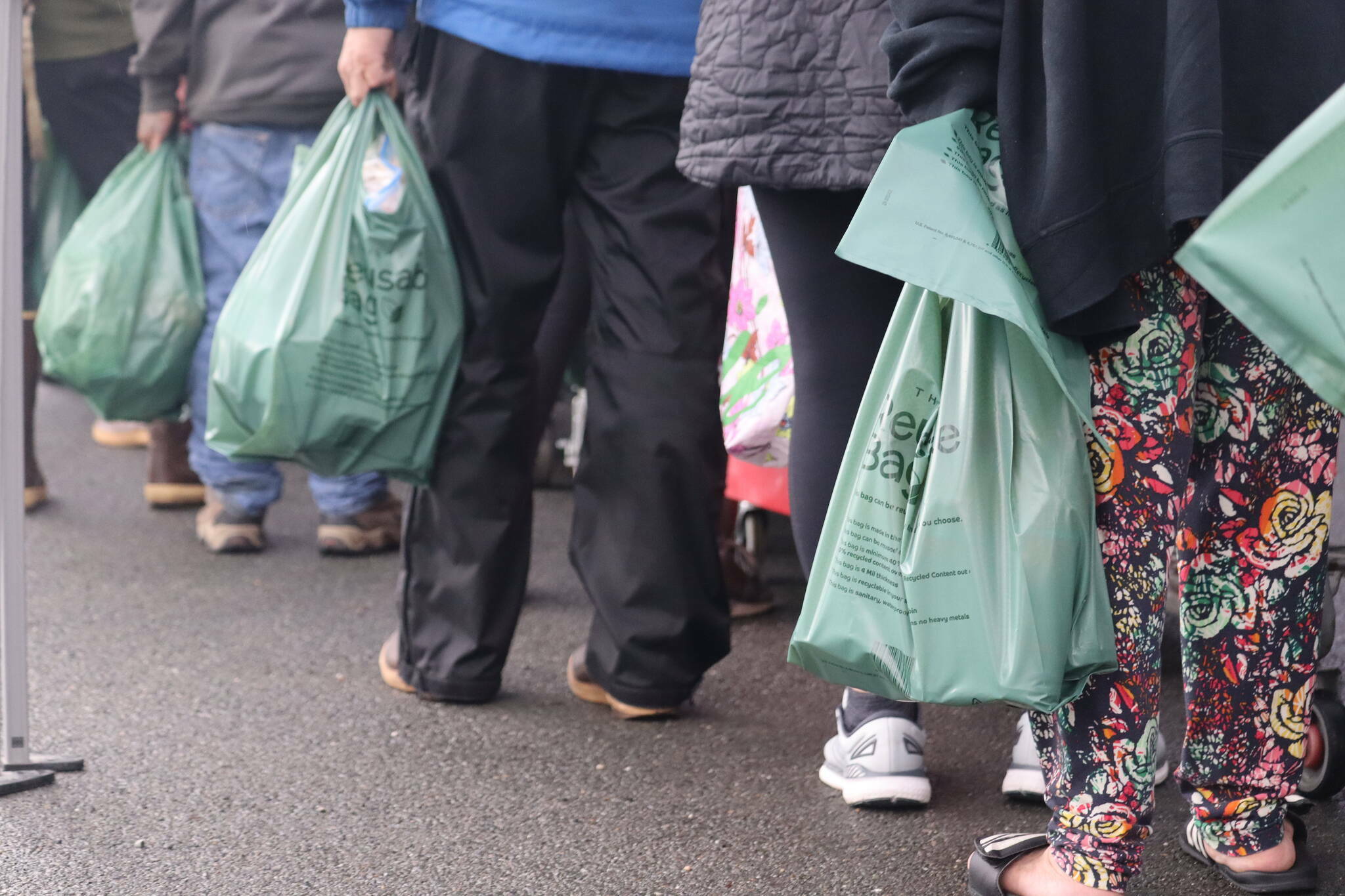 A long line of residents pick up groceries at the Southeast Alaska Food Bank on Aug. 20, 2022. (Jonson Kuhn / Juneau Empire file photo)