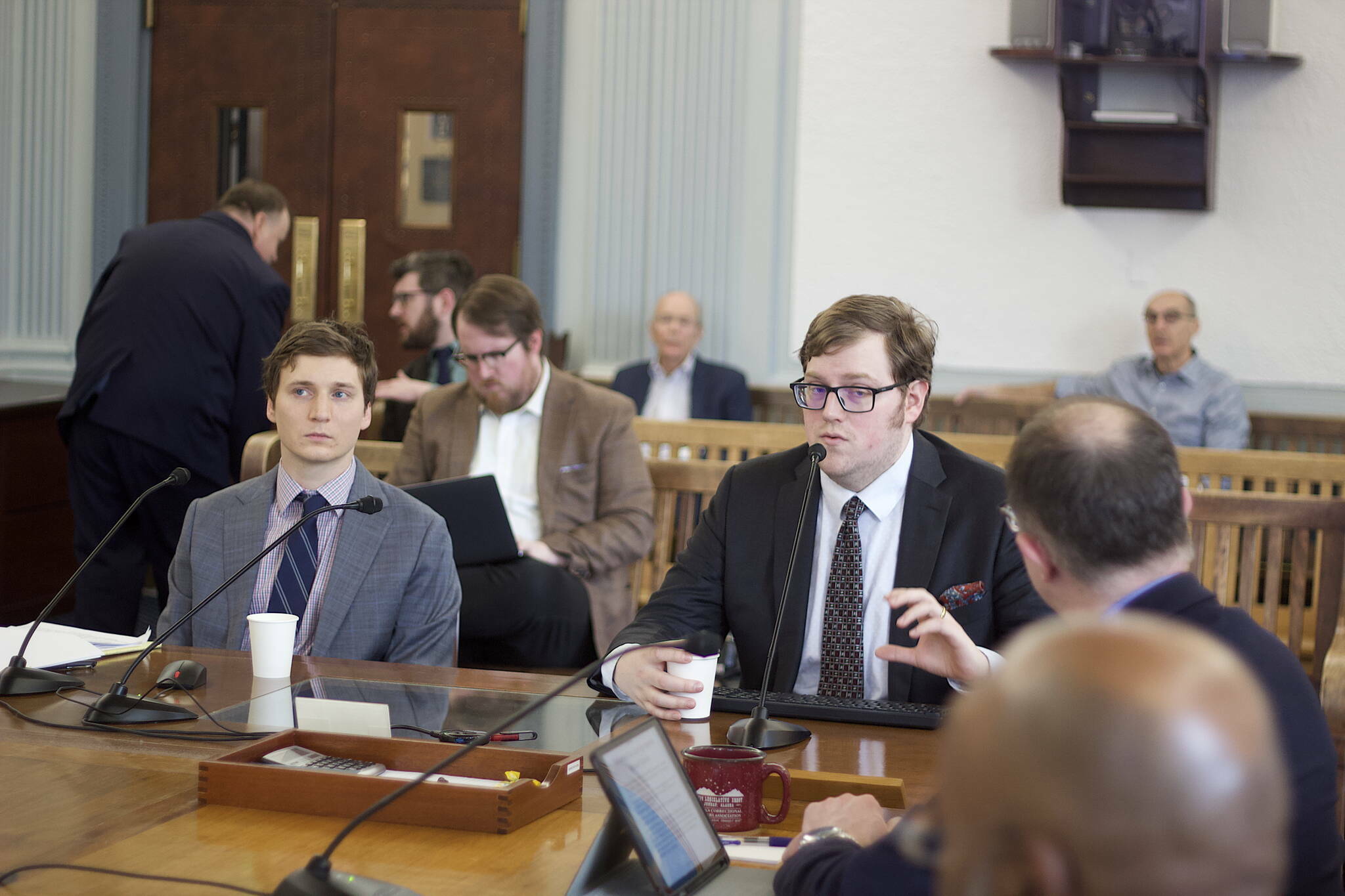 Legislative fiscal analysts Alexei Painter, right, and Conor Bell explain the state’s financial outlook during a presentation to the Senate Finance Committee on March 24, 2023. (Mark Sabbatini / Juneau Empire)