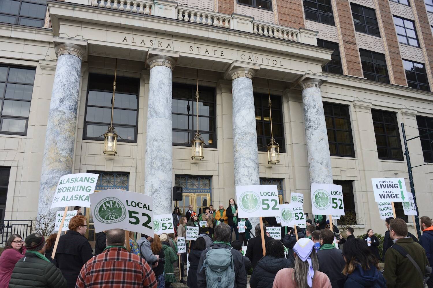 Members of ASEA/AFSCME Local 52 protest on Feb. 10, 2023, in front of the Alaska State Capitol. (Photo by James Brooks/Alaska Beacon)