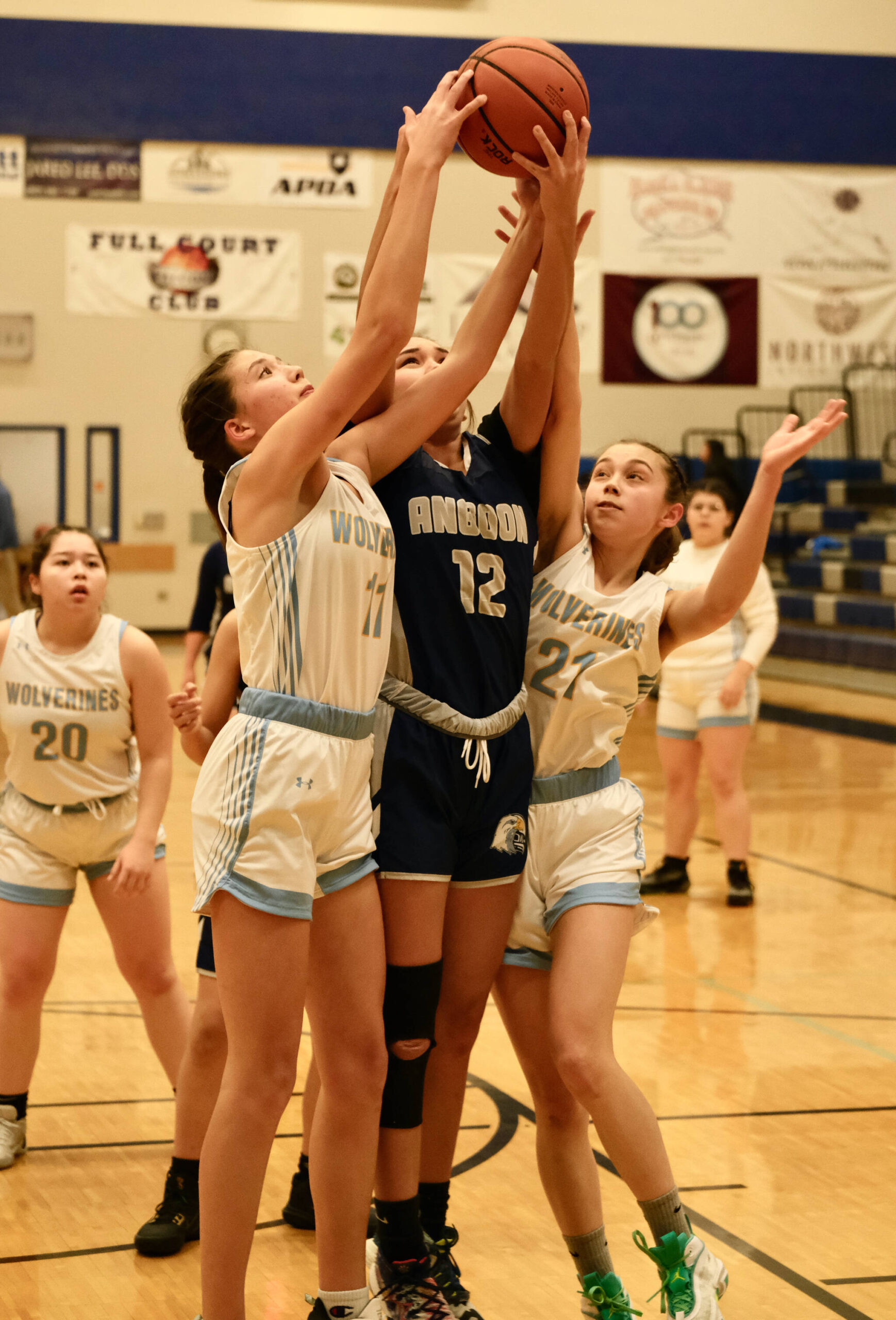 Dillingham’s Kalin Clouse (11), Angoon’s Lisa Kookesh (12) and Dillingham’s Lanny Woods (21) battle for a rebound during the Elizabeth Peratrovich Women’s High School Basketball Invitational Tournament on Thursday at Thunder Mountain High School. The tournament runs through Saturday. (Klas Stolpe / For the Juneau Empire)