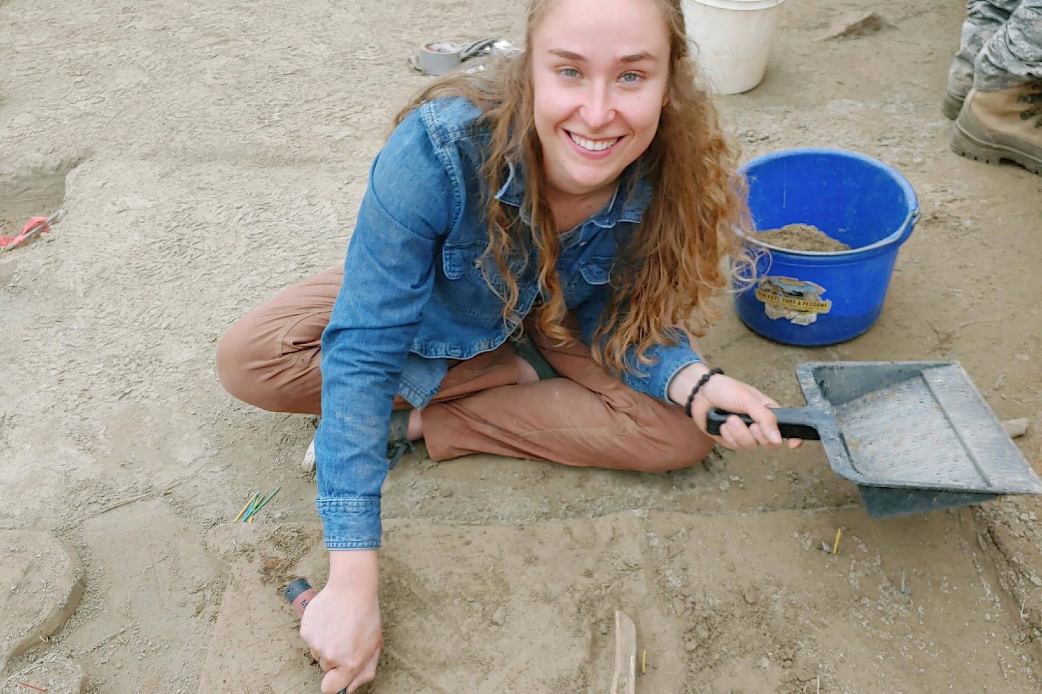 UAF Ph.D. student Audrey Rowe trowels loess soil at an archeological site in the uplands of Interior Alaska. (Photo by Mat Wooller)