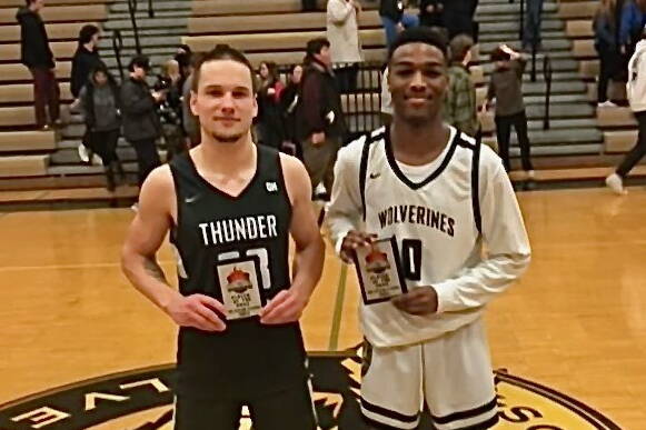 Thunder Mountain High School senior Thomas Baxter and South Anchorage High School senior Larenz Miller were selected Players of the Game after their contest on Friday during the Wolverine Classic Basketball Tournament at SAHS. (Photo courtesy South Anchorage High School)