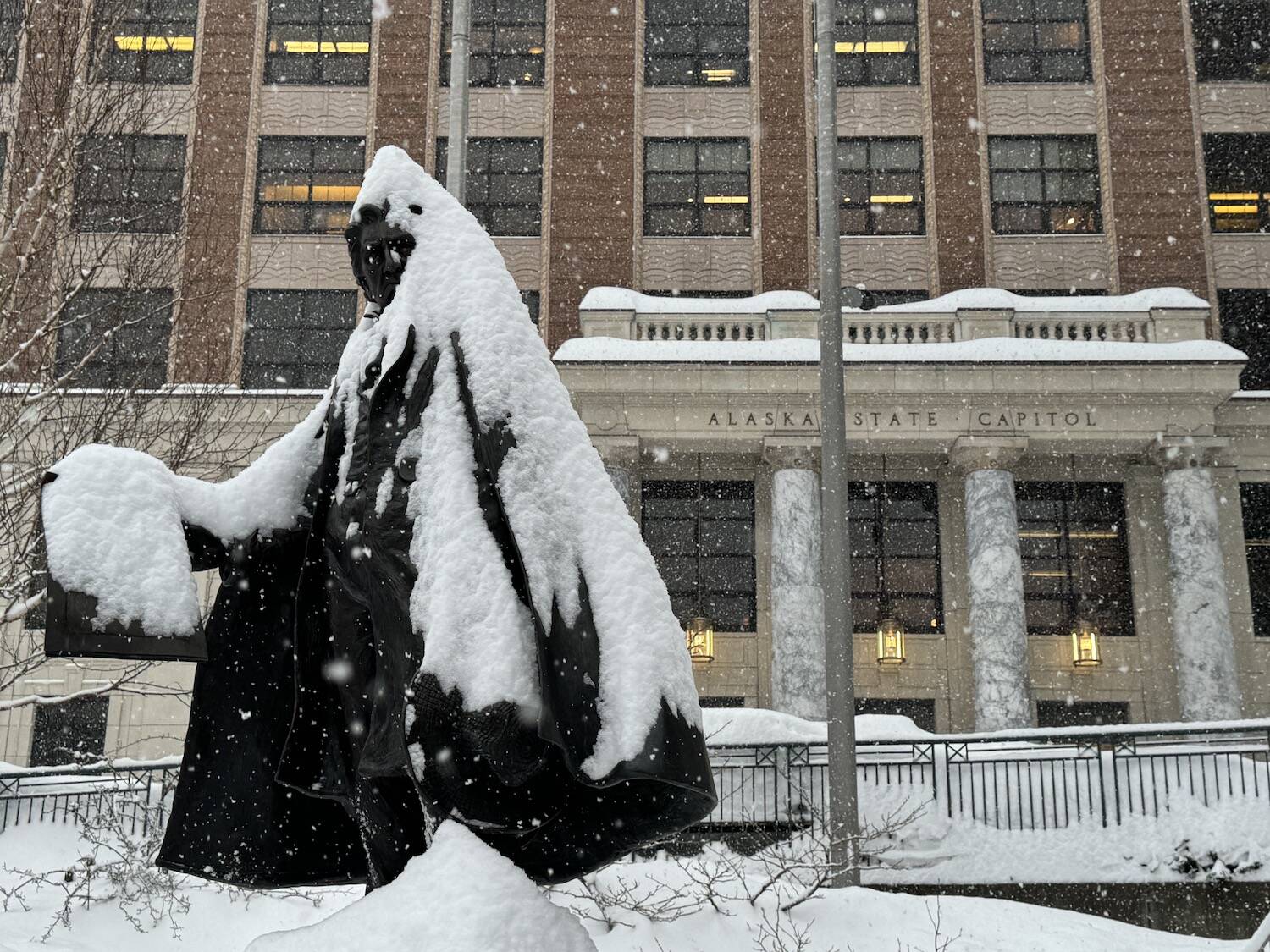 The statue of William Henry Seward in front of the Alaska State Capitol is seen covered in snow on Monday, Jan. 21. Juneau received almost six feet of snow in January. (Photo by James Brooks/Alaska Beacon)