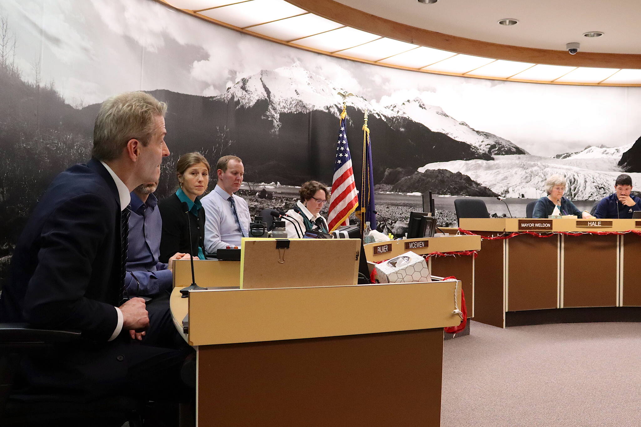 Juneau School District Superintendent Frank Hauser, left, provides an update about the district’s financial situation to Juneau Assembly members and administrative leaders on Monday night at City Hall. A joint meeting of the Assembly and Juneau Board of Education to discuss possible solutions to the district’s financial crisis is scheduled Tuesday night. (Mark Sabbatini / Juneau Empire)