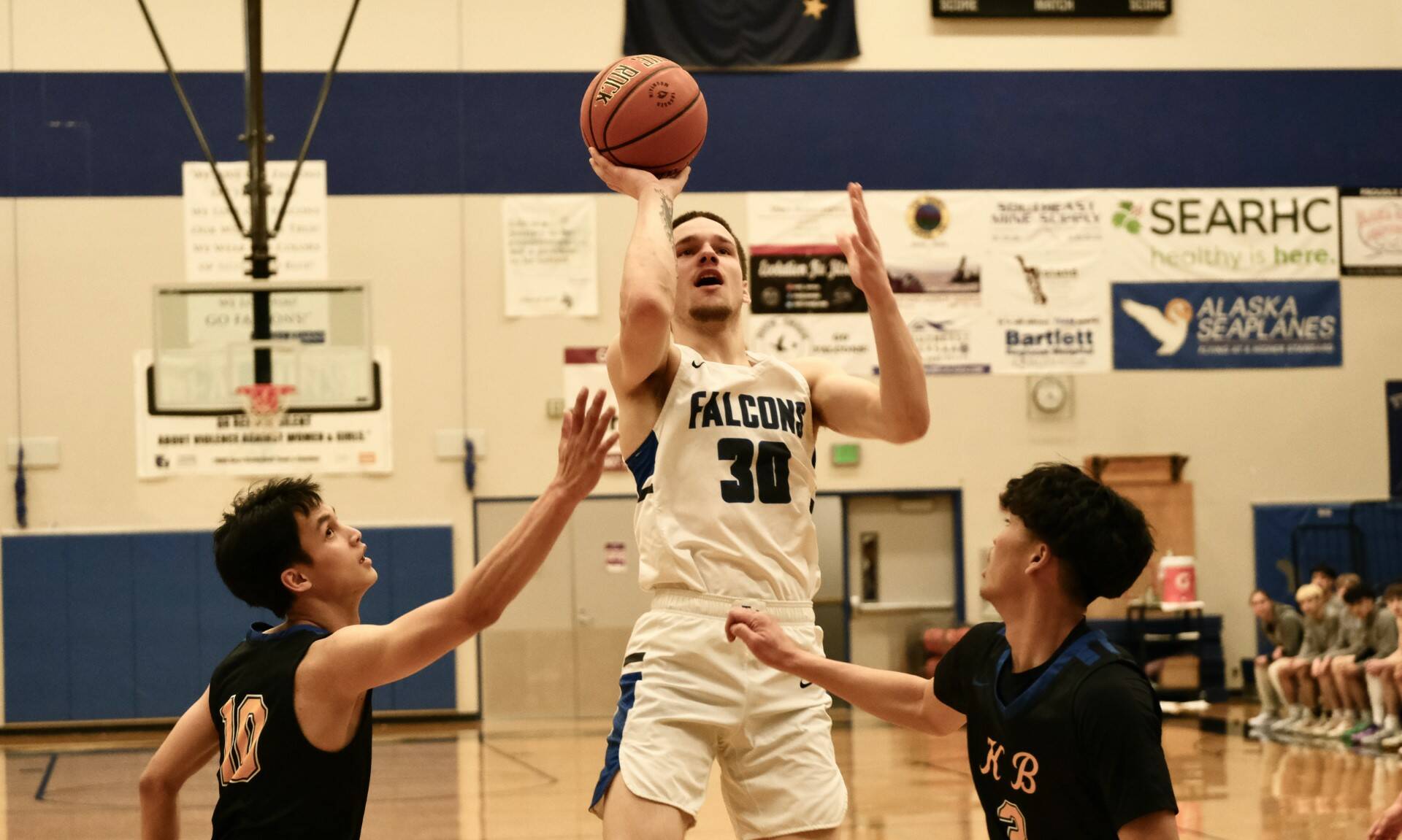 Thunder Mountain High School senior Thomas Baxter (30) shown in action against Kodiak on Thursday, scored 30 points to lead the Falcons over the Ketchikan Kings at Kayhi on Saturday. (Klas Stolpe/For the Juneau Empire)