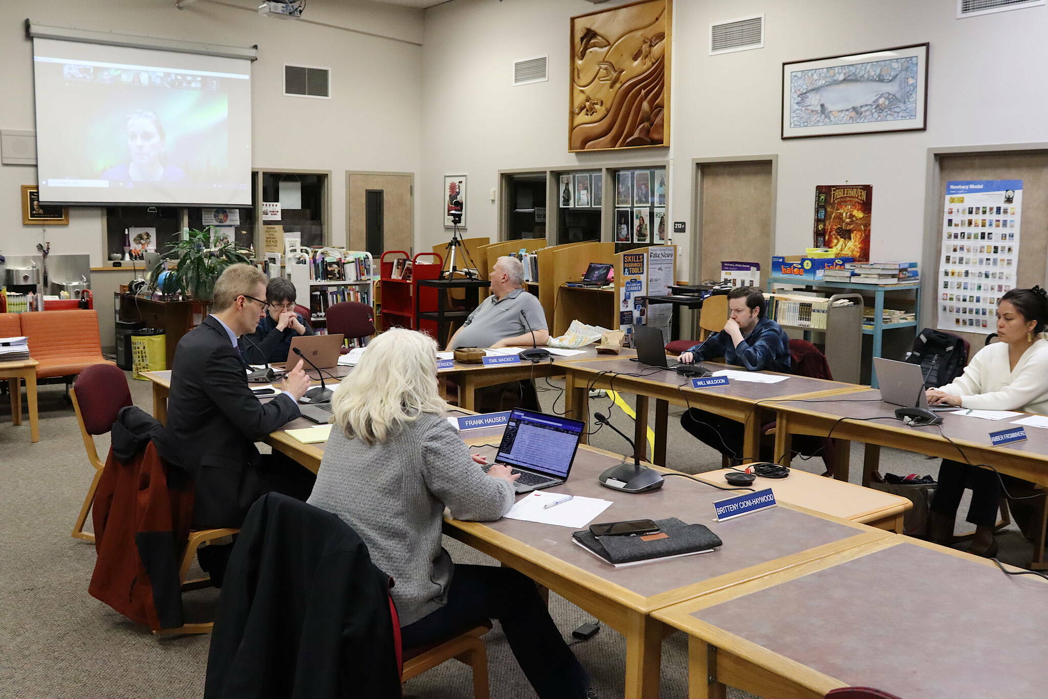 Juneau School District administrators and board members listen to a presentation about the district’s multi-million deficit during a Jan. 9 meeting. (Mark Sabbatini / Juneau Empire file photo)