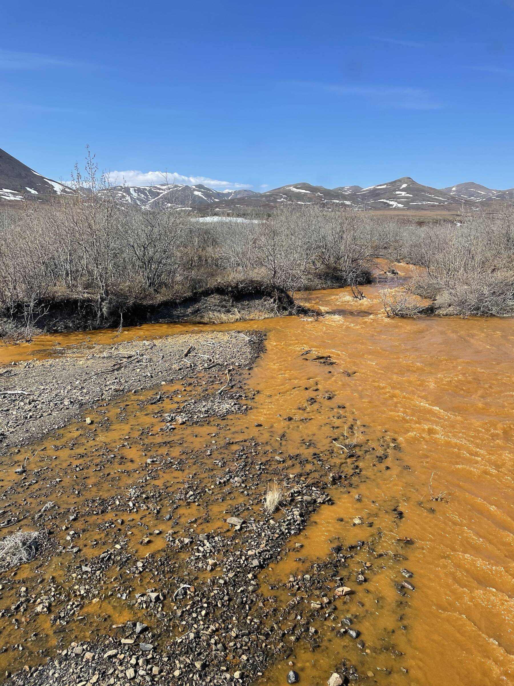 Josh Koch took this photo of the Kugororuk River in northern Alaska in June 2023. The orange stream color reflects oxidized iron, but also often indicates elevated heavy metal concentrations. (Photo by Josh Koch)