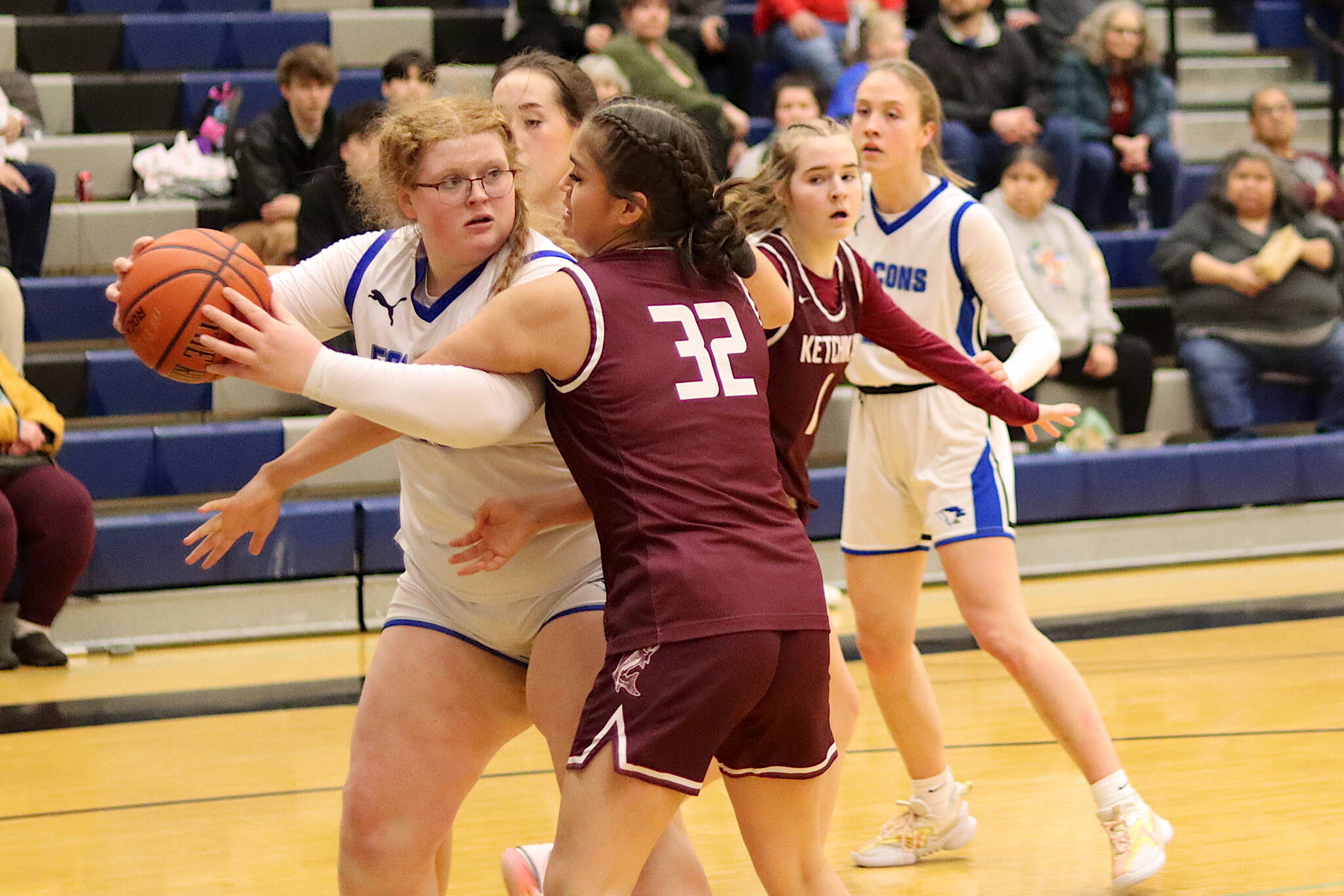 Thunder Mountain High Schools Kara Strong keeps the ball away from Ketchikan High Schools Kylie Brendible during Saturday nights game at TMHS. (Mark Sabbatini / Juneau Empire)