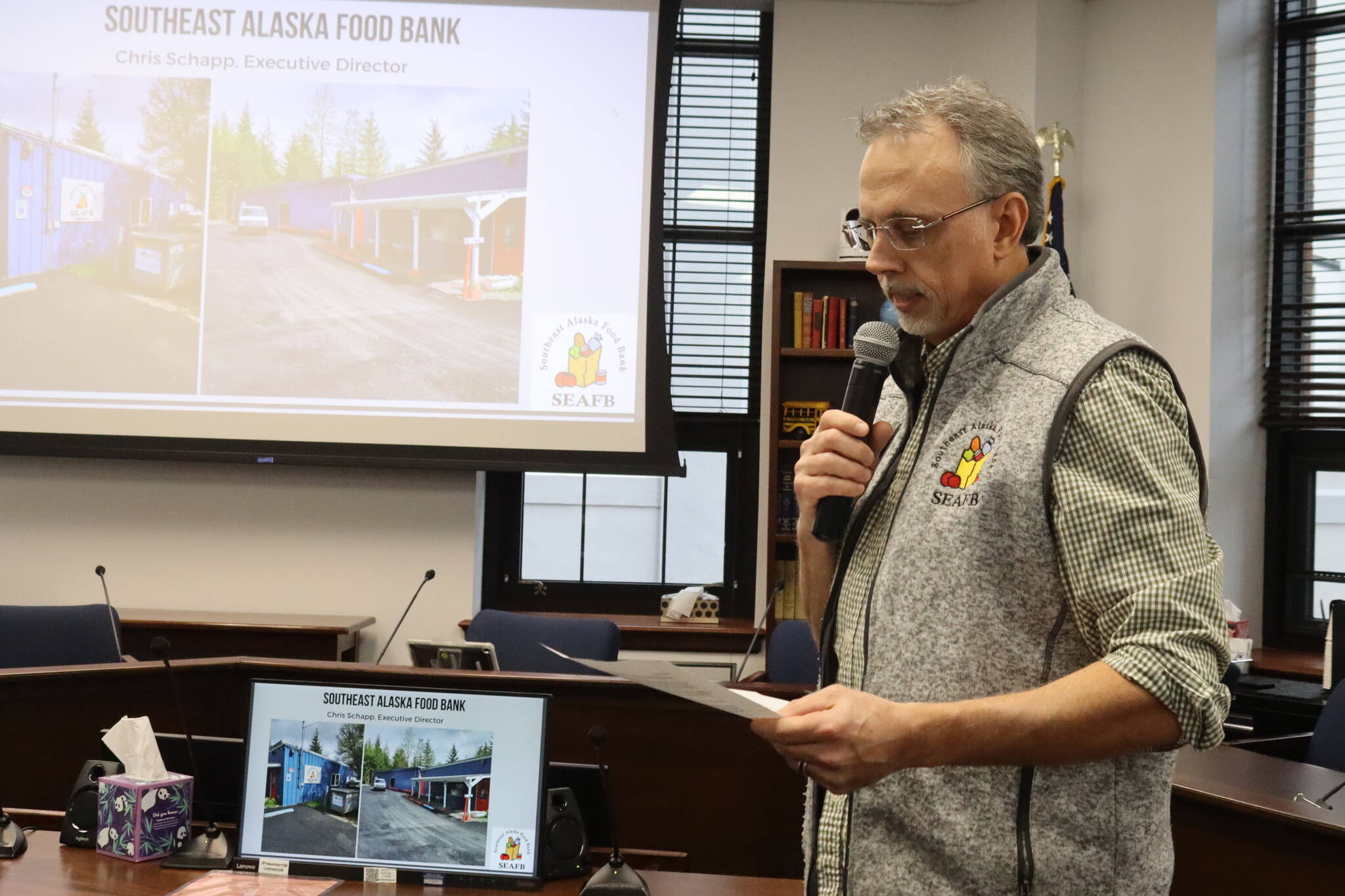 Chris Schapp, executive director of the Southeast Alaska Food Bank, discusses record demand during the past year and steps the organization is trying to do to help those in need during a presentation Monday at the Alaska State Capitol. (Mark Sabbatini / Juneau Empire)