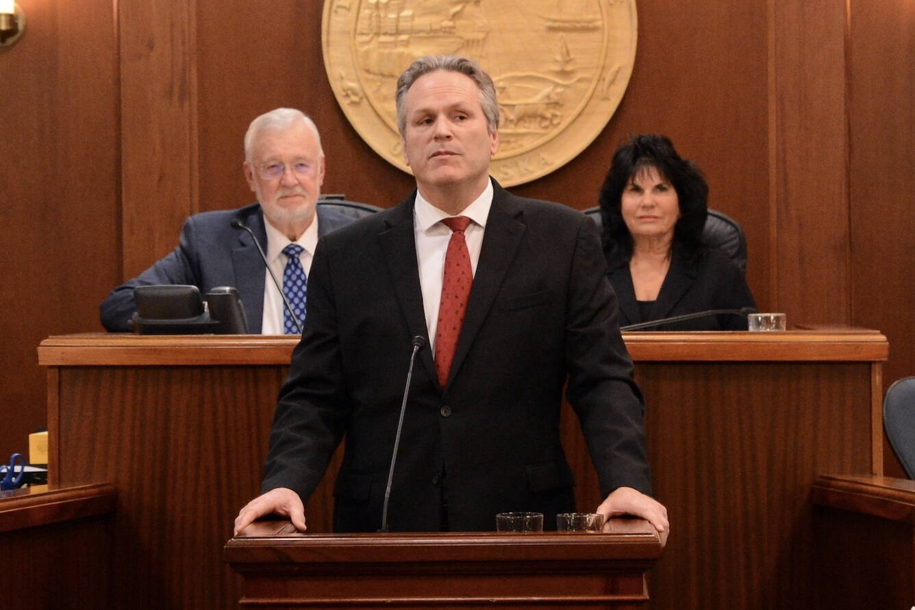 Gov. Mike Dunleavy delivers the State of the State address on Tuesday, Jan. 30, at the Alaska State Capitol. Behind him are Senate President Gary Stevens, R-Kodiak, and Speaker of the House Cathy Tilton, R-Wasilla. (Photo by James Brooks/Alaska Beacon)