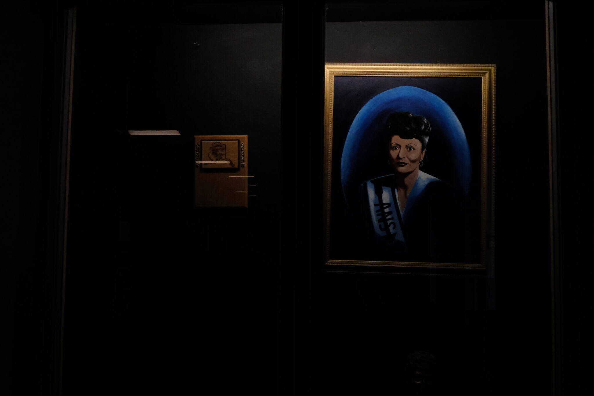 A framed picture of Alaska Native civil rights leader Elizabeth Peratrovich is seen in the lobby outside of Elizabeth Peratrovich Hall on Friday. (Photo by Claire Stremple/Alaska Beacon)