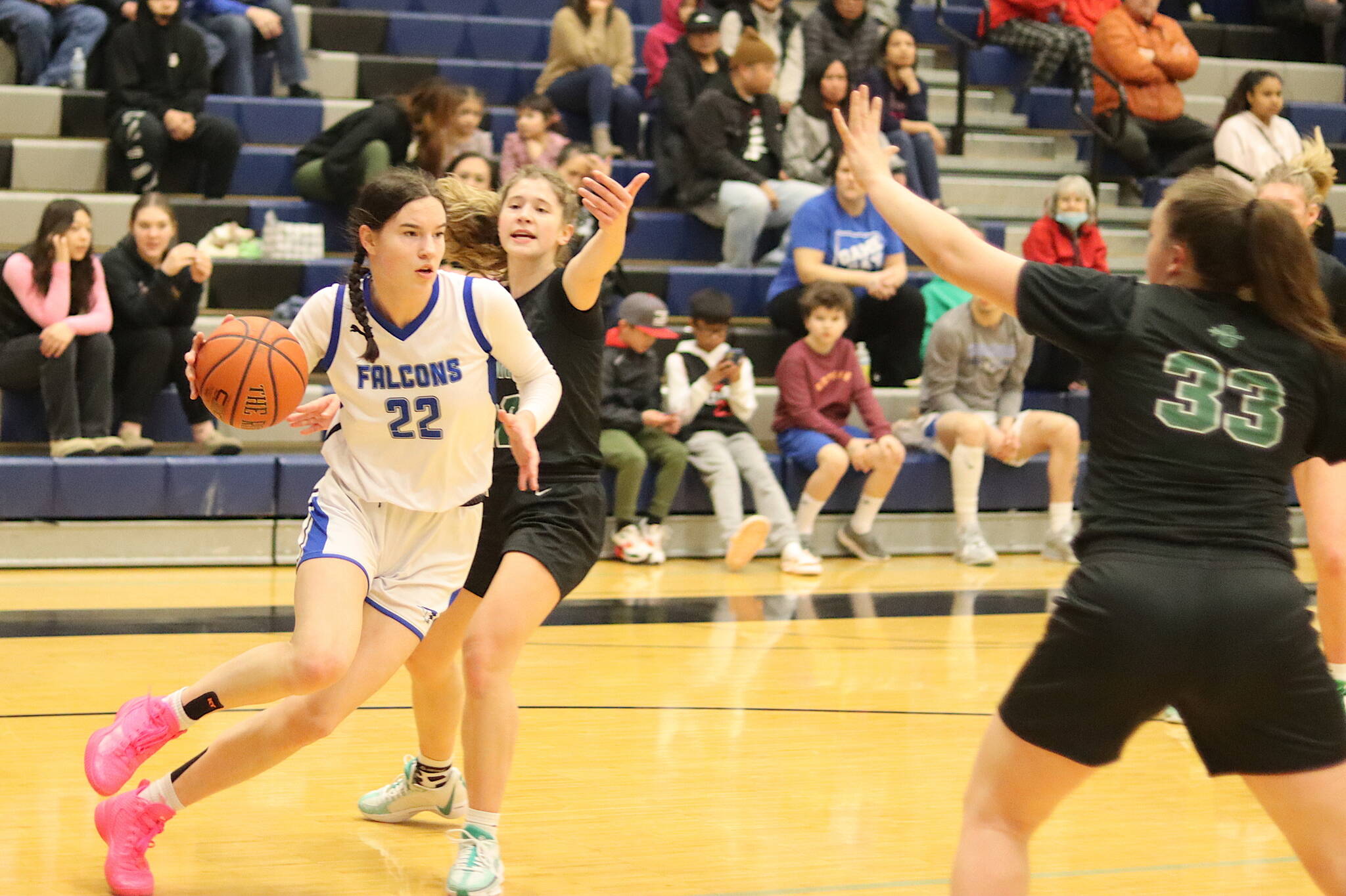 Thunder Mountain High Schools Kerra Baxter (#22) tries to penetrate Colony High Schools defense during Saturdays game at TMHS. (Mark Sabbatini / Juneau Empire)
